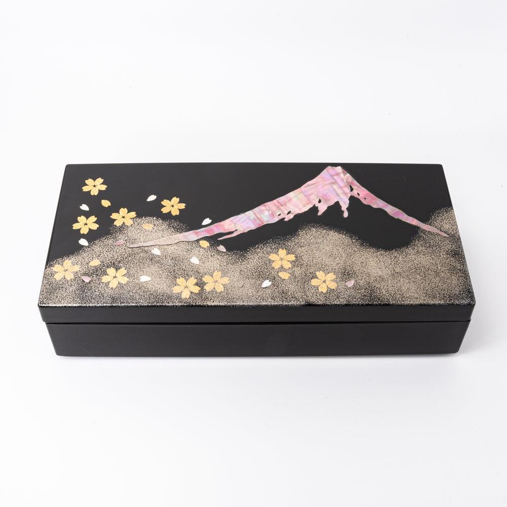 Black lacquer Japanese pen box closed showing full lid design with raden Mt. Fuji, silver maki-e foothills, and gold sakura