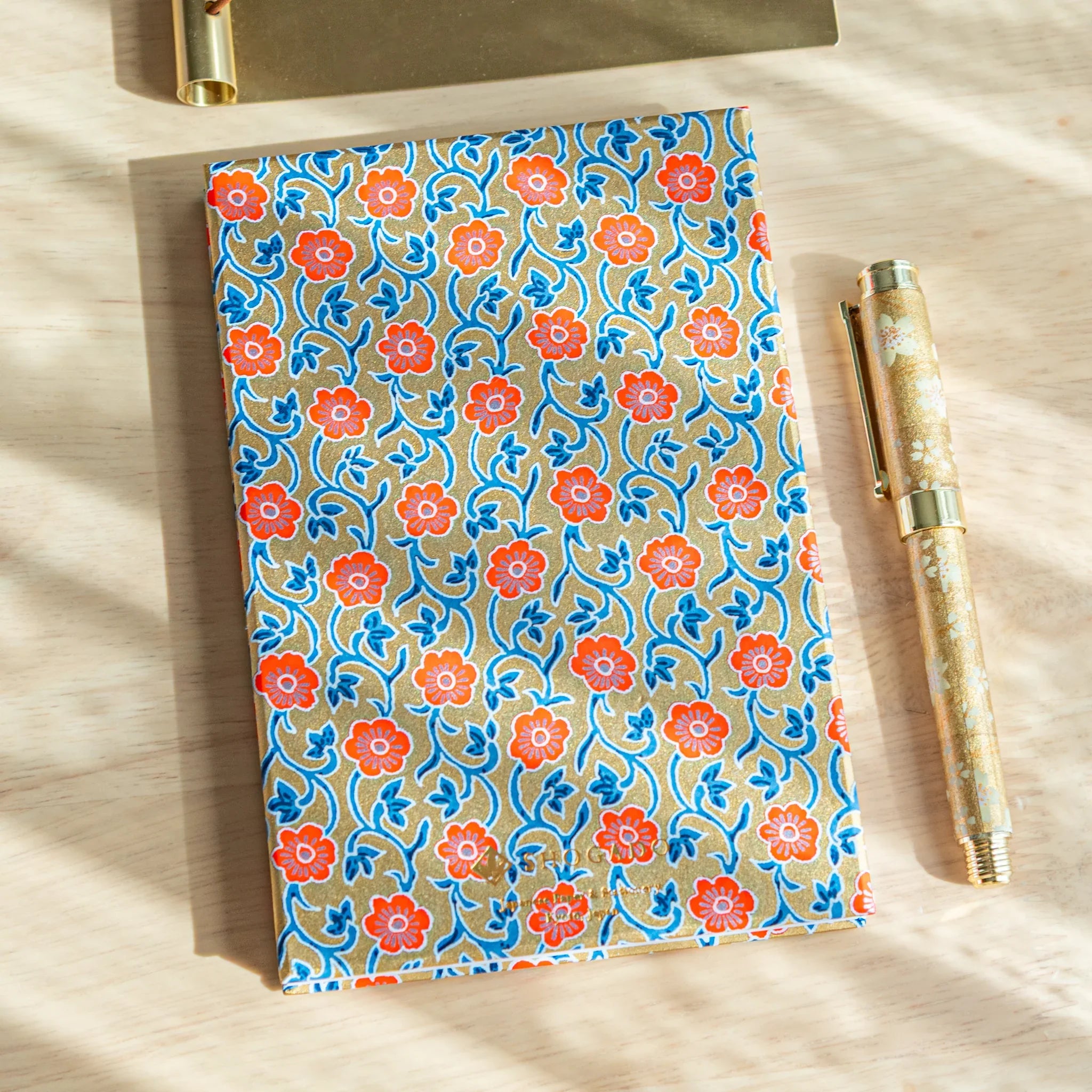 Red Flower Washi Goshuincho closed cover showing vibrant red washi with traditional flower pattern and Japanese design