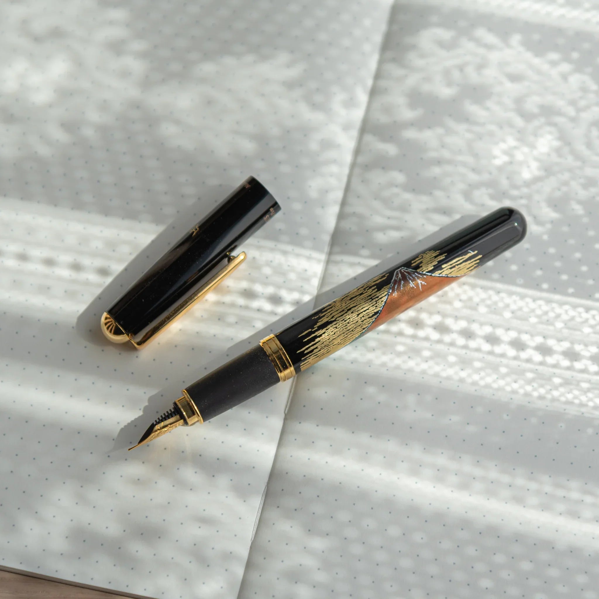 Red Fuji Yamanaka Fountain Pen, image 4: side profile showing depth and shape presenting visual clarity