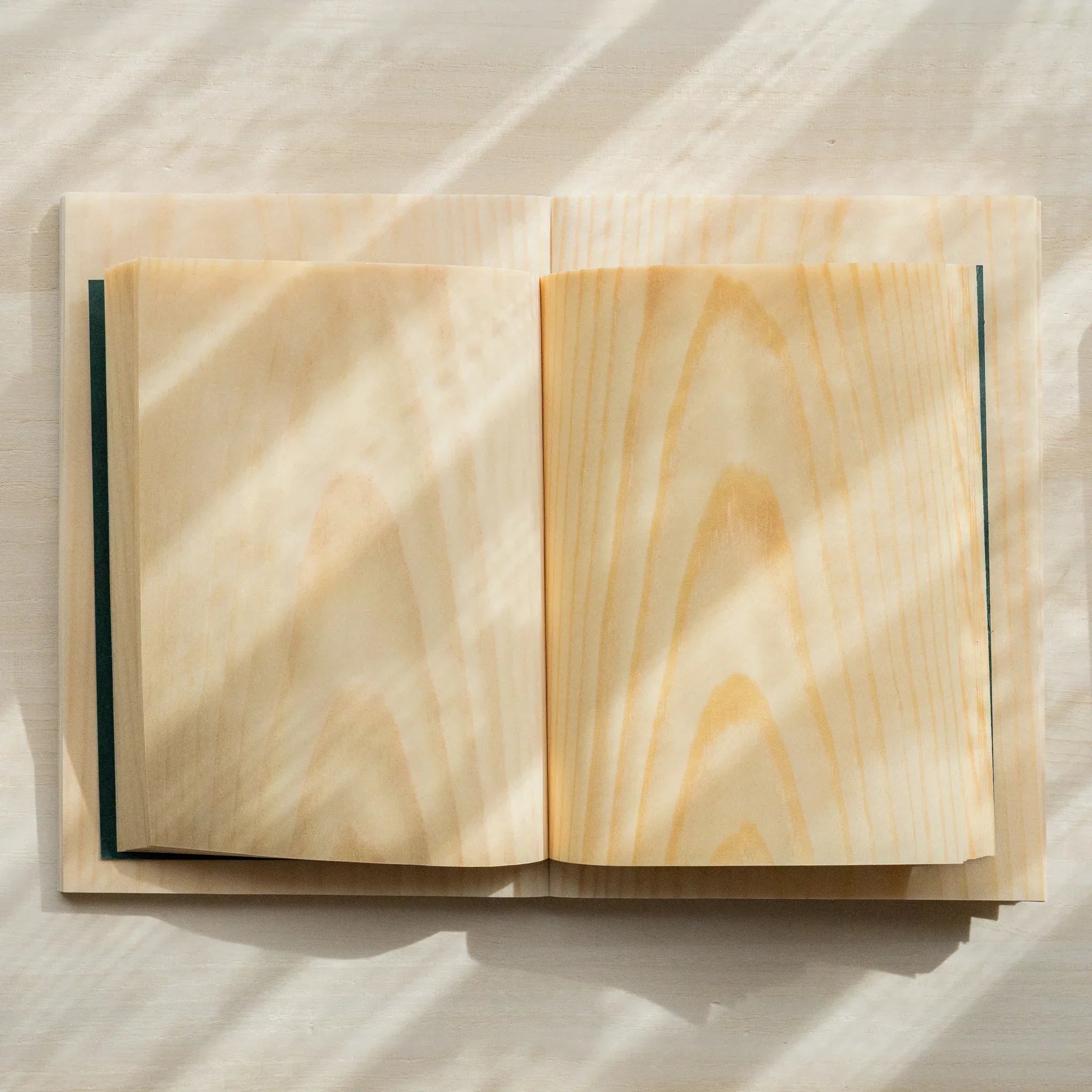 Red Pine B6 wooden page notebook, angled view highlighting natural wood color tone and texture showing natural wood material