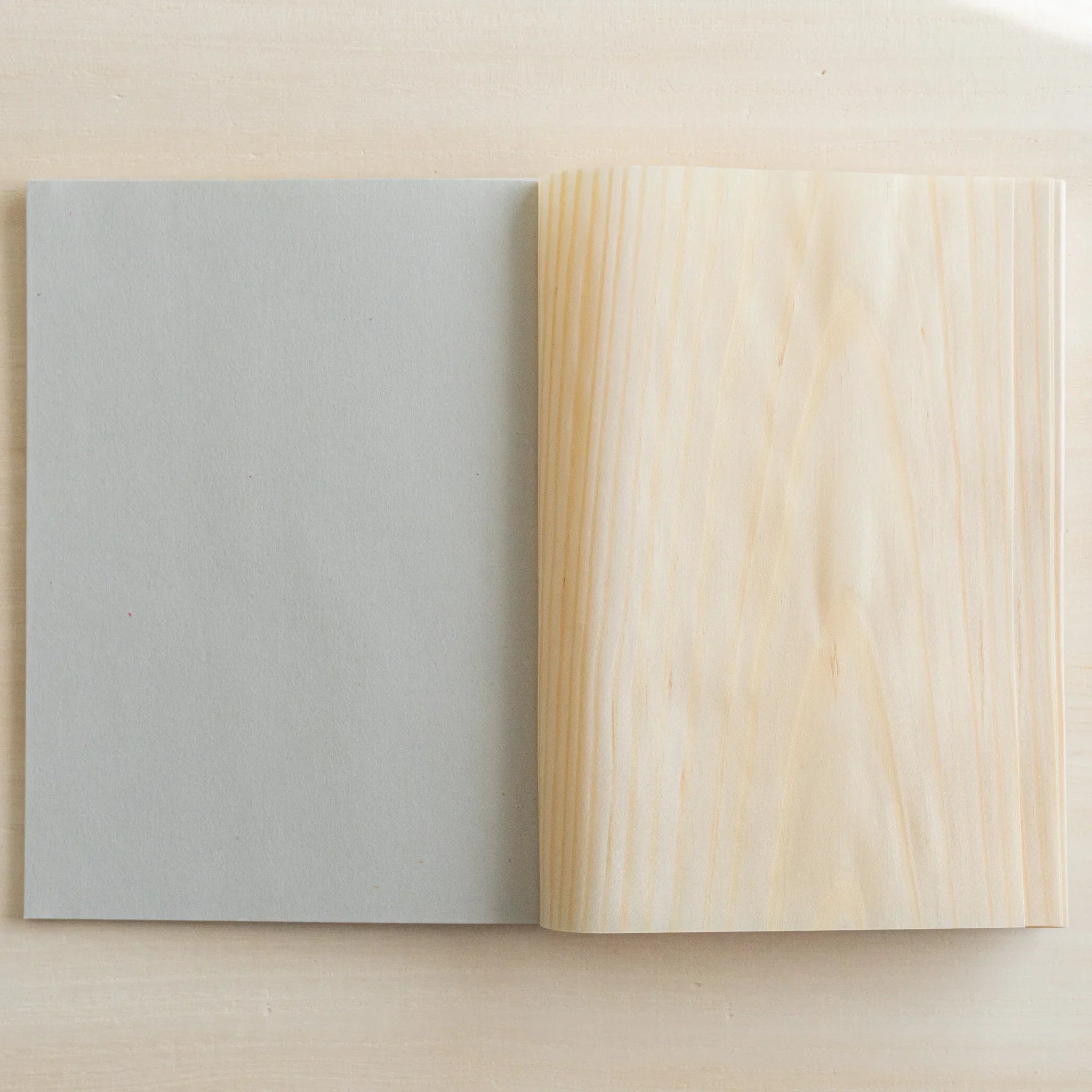 Red Pine wooden page B6 notebook, flat lay of closed journal emphasizing natural grain pattern detail