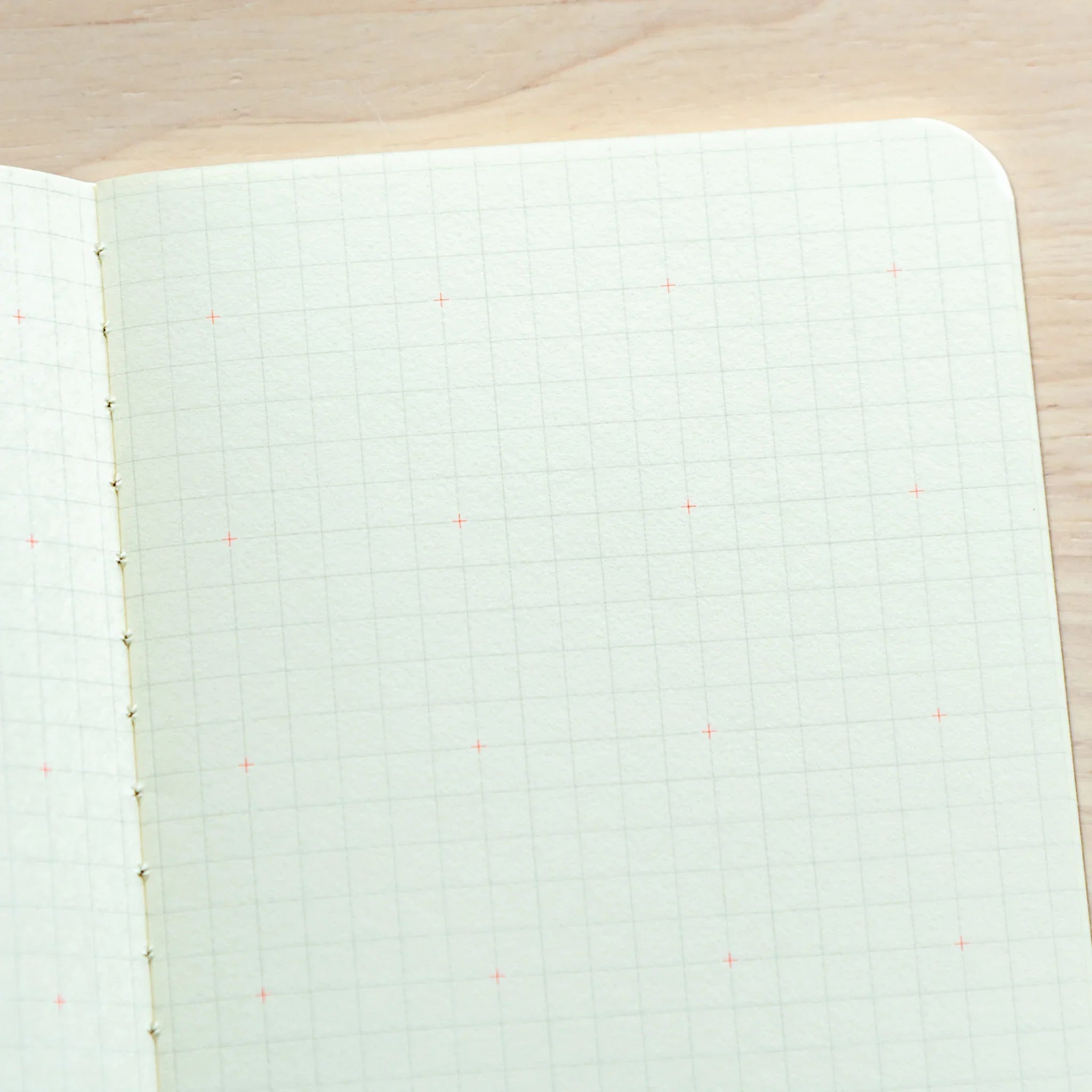 RO-BIKI Basic notebook with 4.5mm grid and cross marks shown flat, displaying slate cover and structured layout