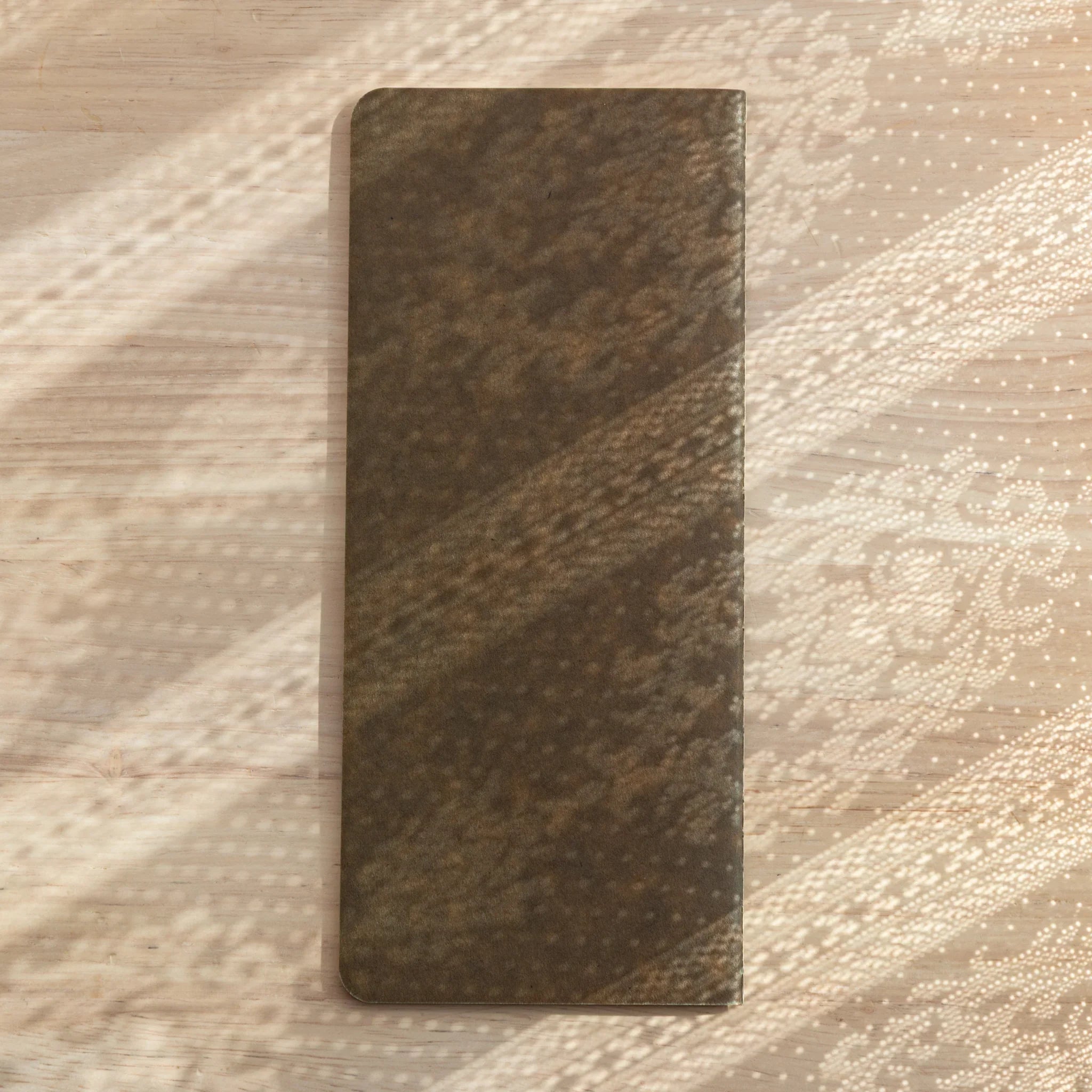 Close-up of sturdy kraft Japanese Notebook cover, natural brown tone, grid pages for Japanese Fountain Pen.