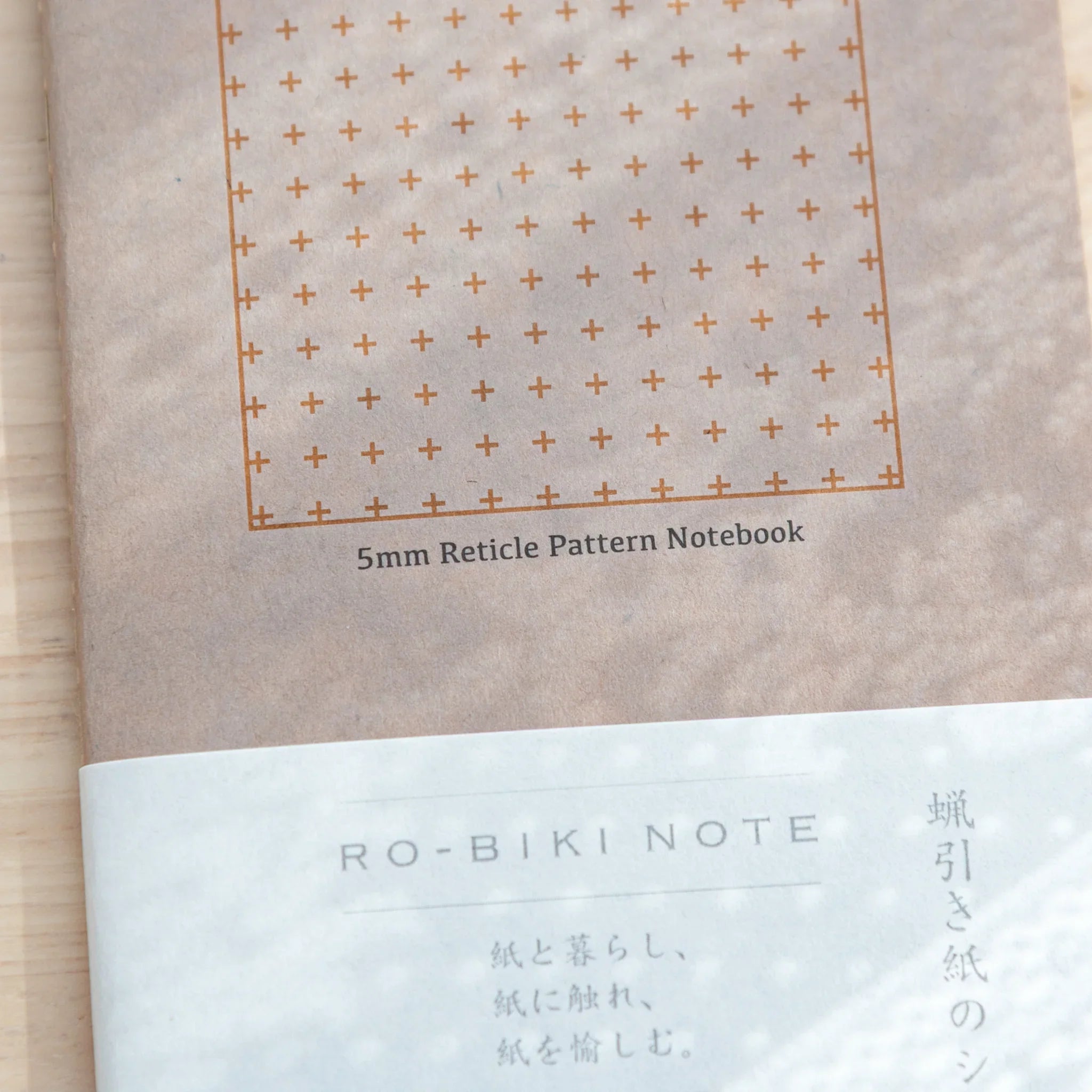 RO-BIKI Basic Series 5mm reticle grid notebook displayed flat showing cover design and structured grid pattern layout