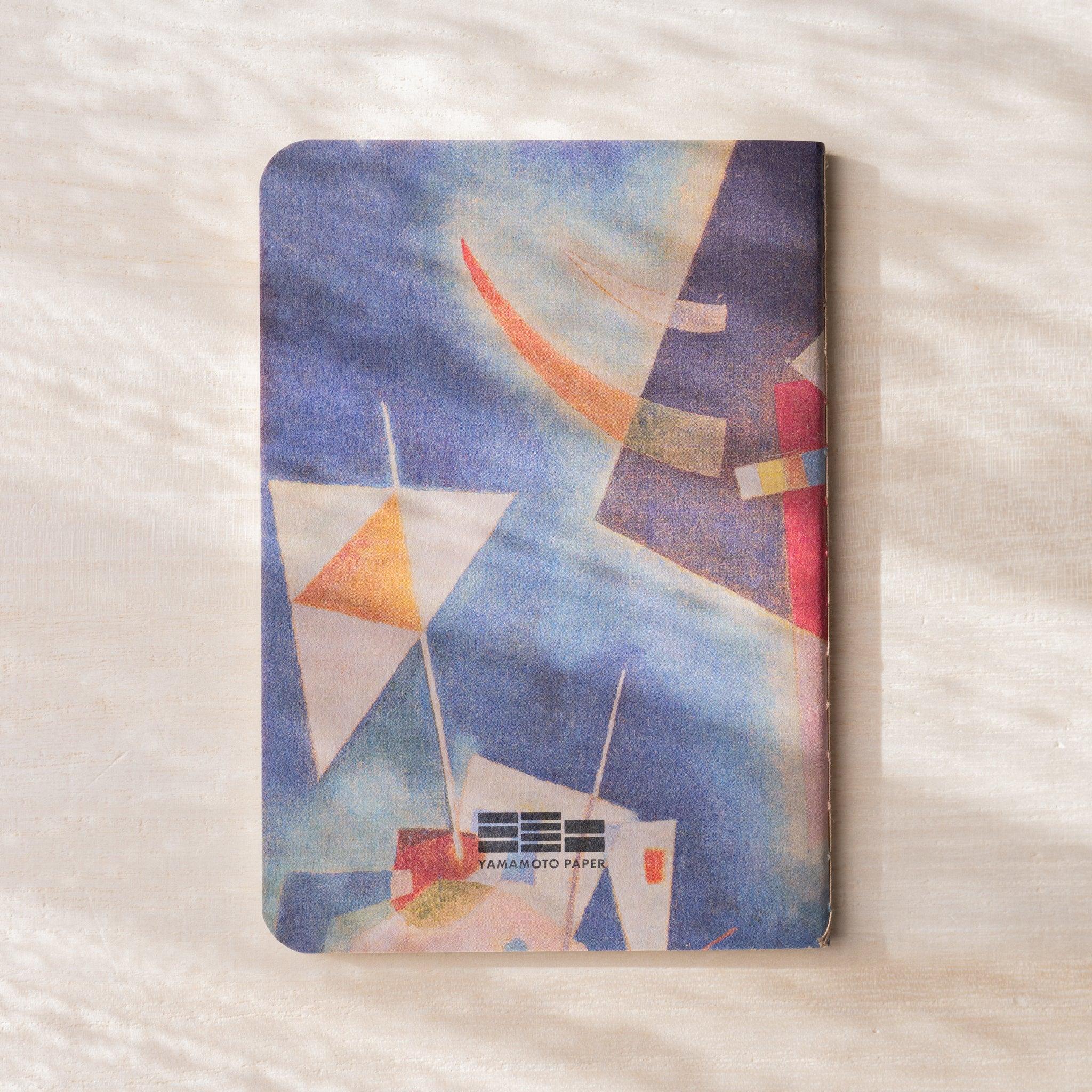 RO-BIKI NOTE back cover with blue abstract geometric painting and triangle shapes, YAMAMOTO PAPER logo, no belly band