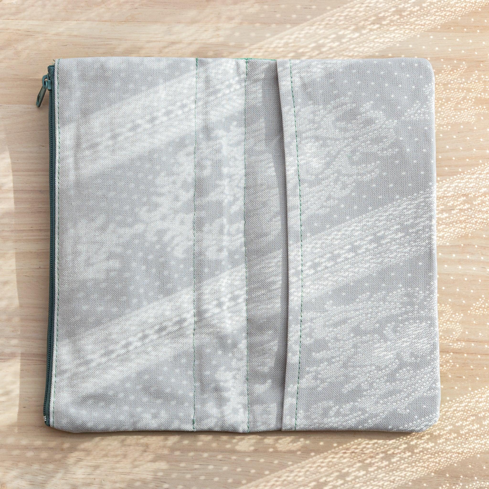Backside of Japanese Note Book Cover in vintage blue canvas, showing durable stitching and zipper closure.