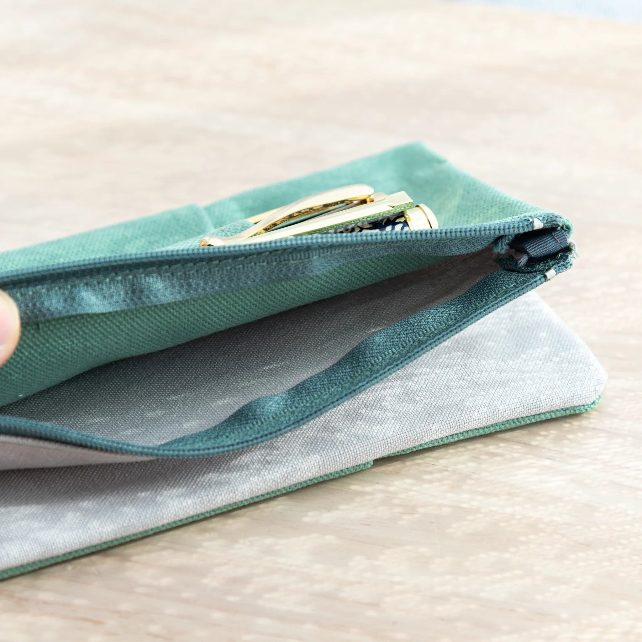 Top view of Japanese Note Book Cover with zipper pocket, organic cotton canvas in vintage blue color.