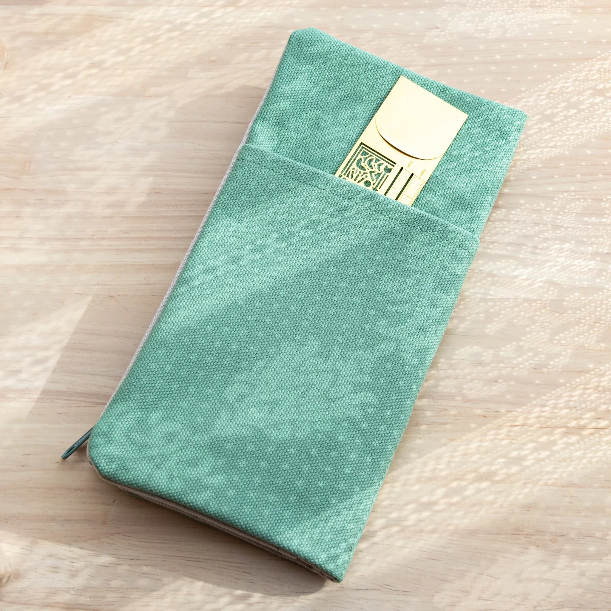 Backside of Japanese Note Book Cover in vintage blue canvas, showing durable stitching and zipper closure.