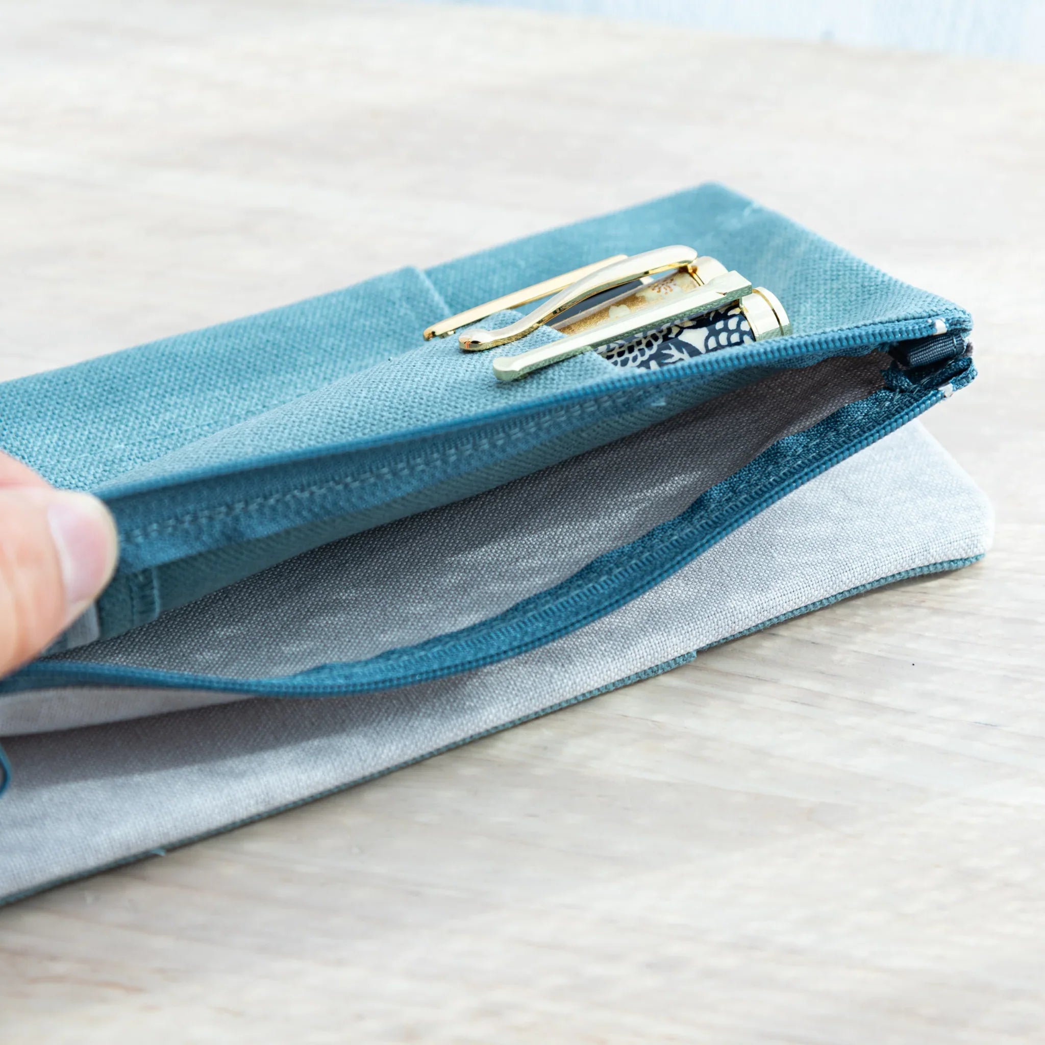 RO-BIKI Canvas Cover in vintage blue displayed showing integrated stationery pocket on front, Japanese quality organizer
