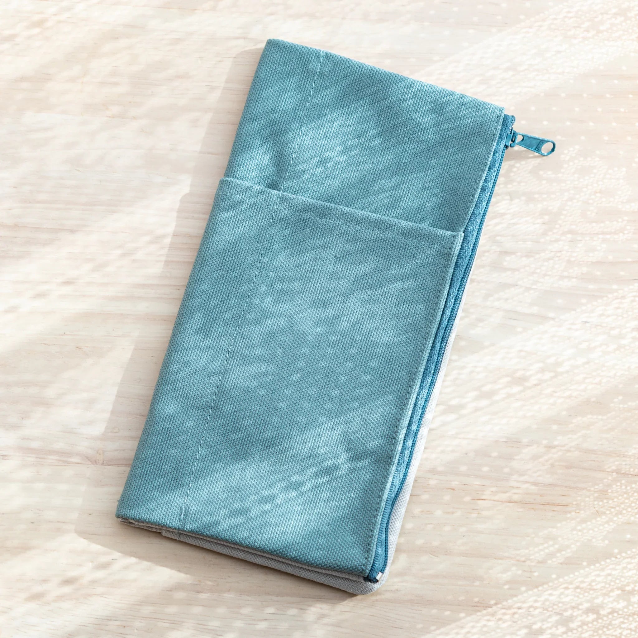 Japanese Notebook Cover in minimalist blue canvas with zipper closure.