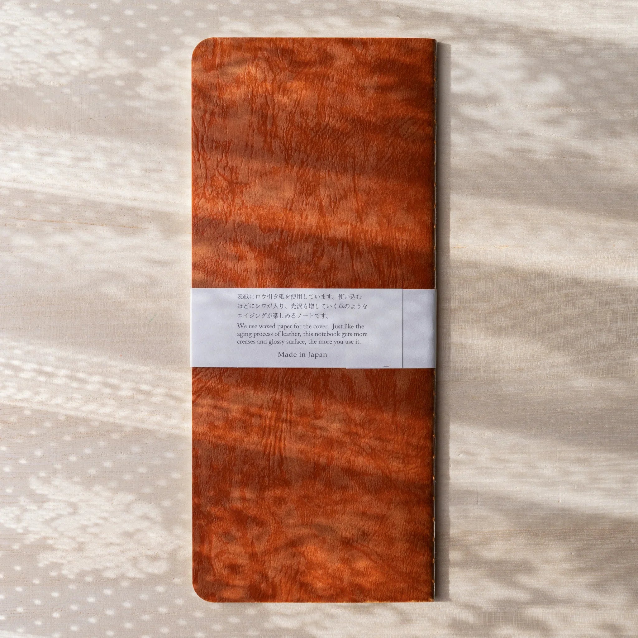 RO-BIKI NOTE Edocha Brown back cover with product description label about wax aging process, Made in Japan