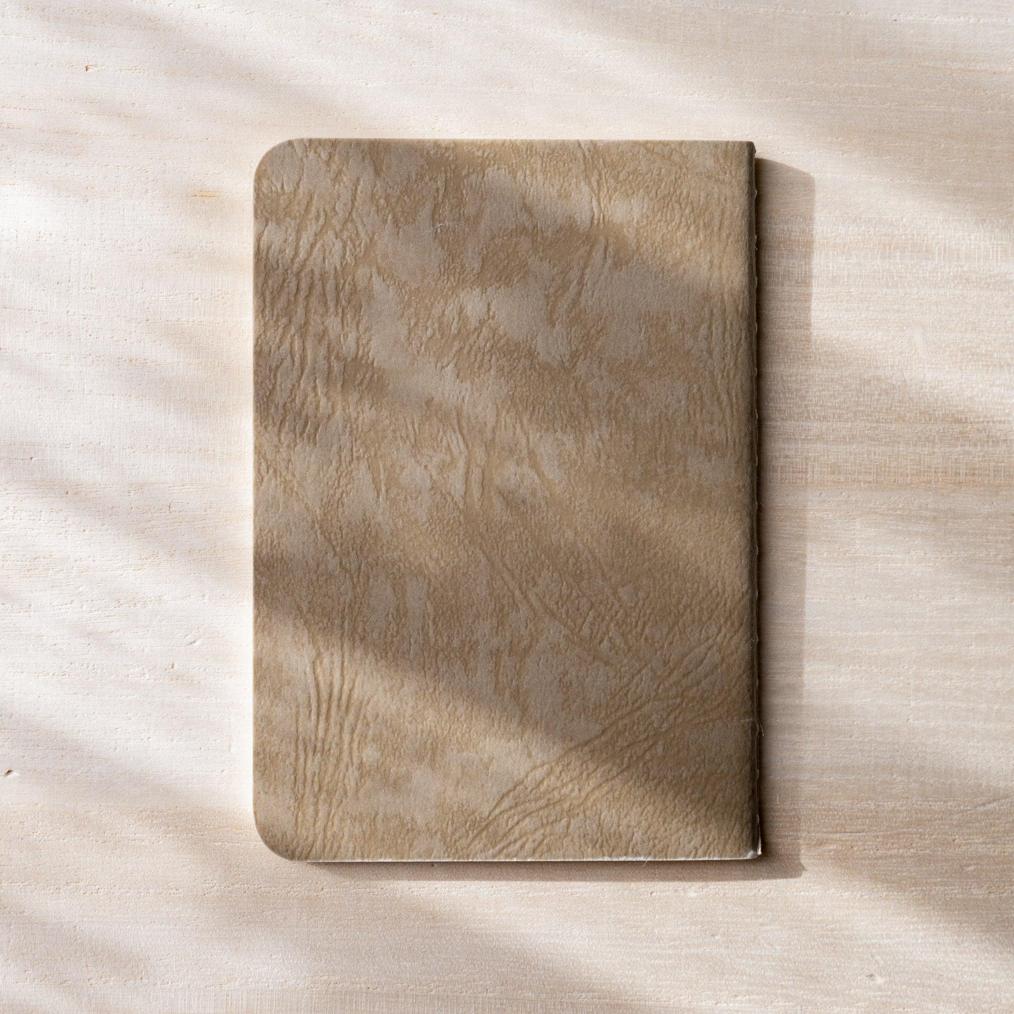Back cover view of RO-BIKI NOTE fushi brown waxed cover, Yamamoto Paper logo, rounded corners and spine