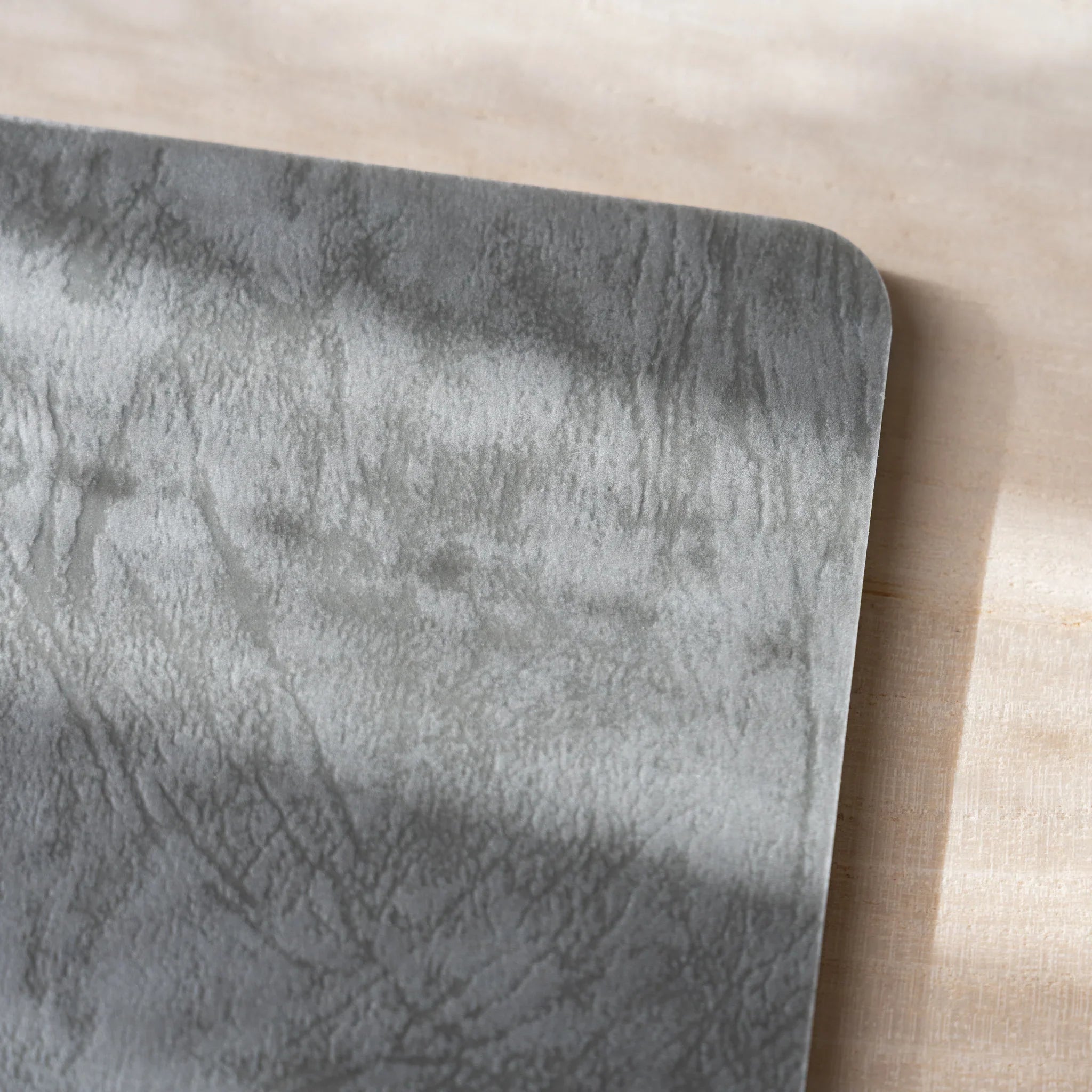 Close-up detail of RO-BIKI NOTE Ginnezu gray Texture Series wax coating showing unique marbled pattern on cover