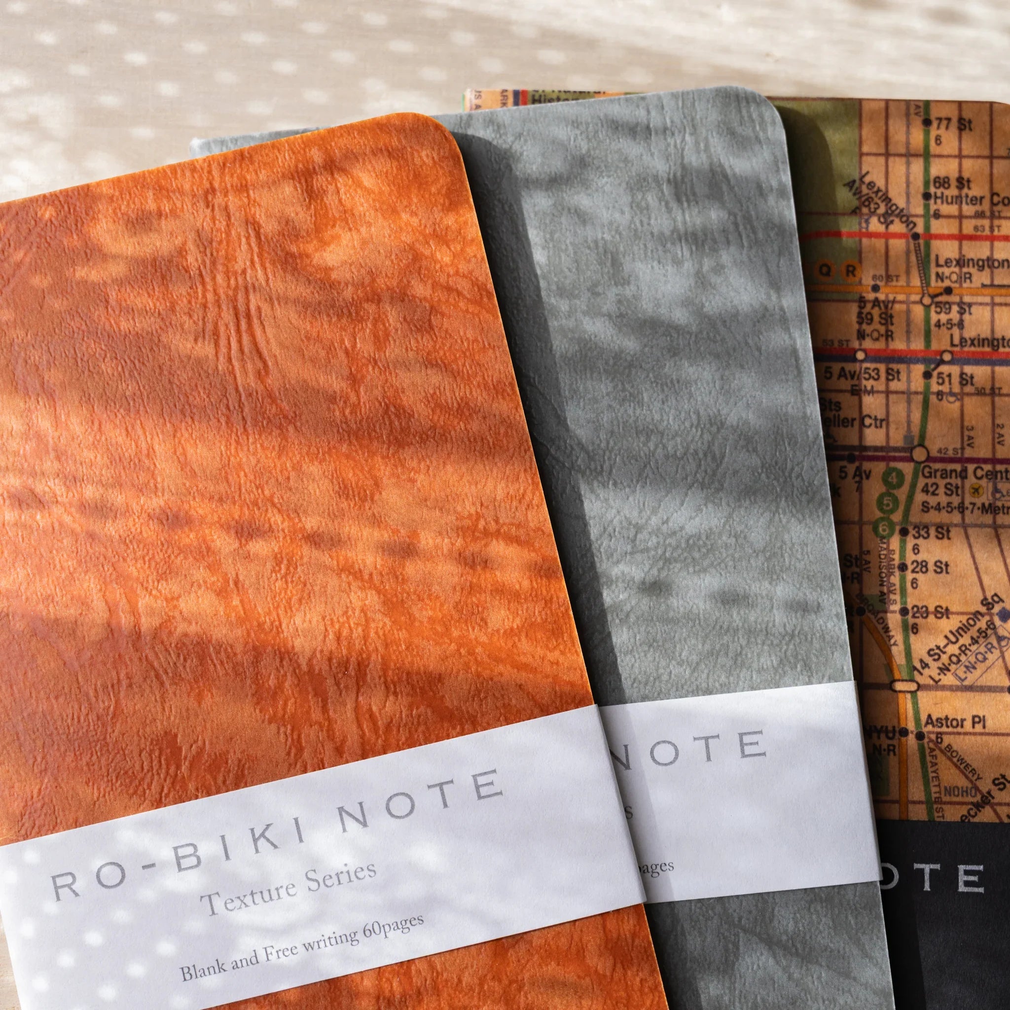 RO-BIKI NOTE Texture Series and Map Series Japanese wax-coated notebooks in Edocha brown and Ginnezu gray colors