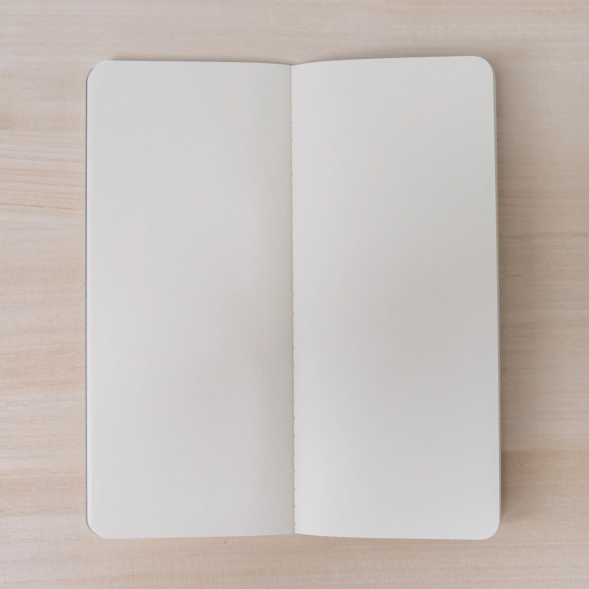 RO-BIKI NOTE Ginnezu gray notebook open to center spread showing blank cream woodfree Solist paper pages