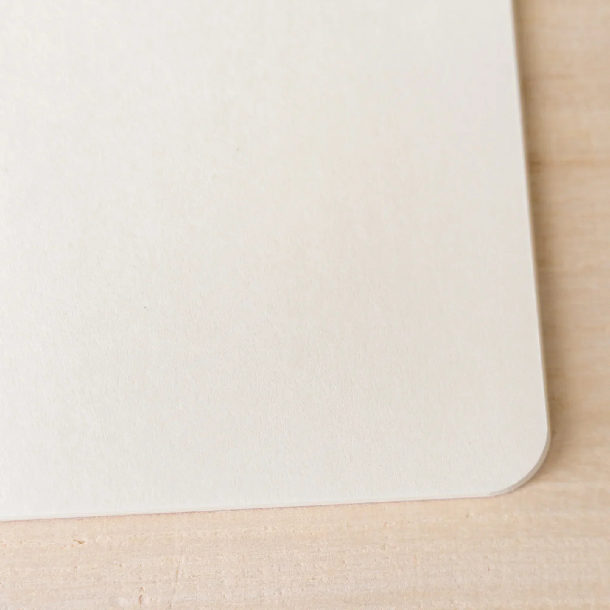 Back cover view of RO-BIKI NOTE tonoko beige waxed cover with black binding and spine, rounded corners