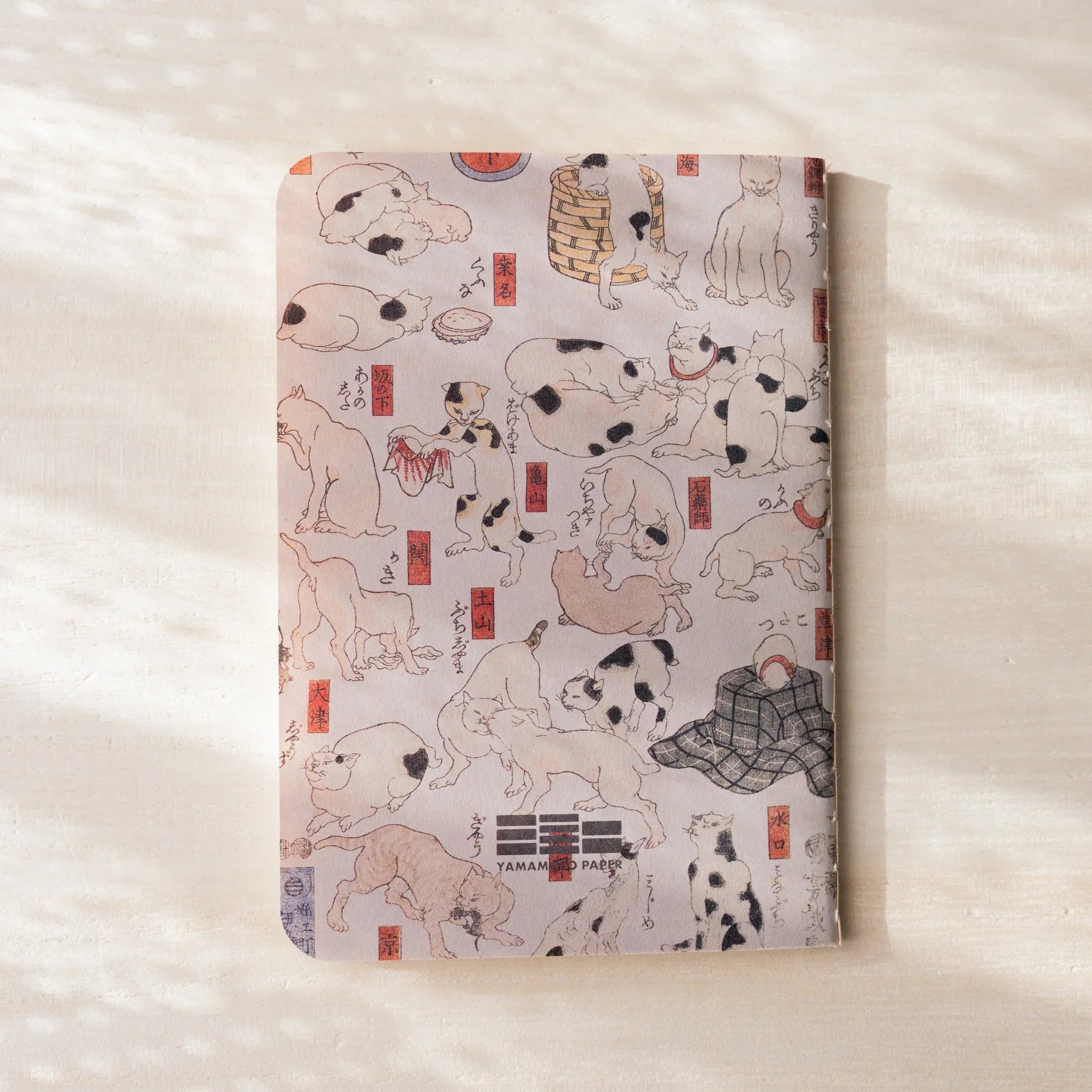 RO-BIKI NOTE back cover showing full cat woodblock print with red seals, Yamamoto Paper label at bottom, no belly band
