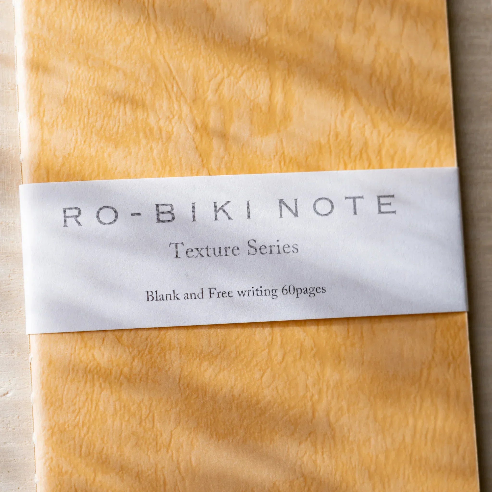 RO-BIKI NOTE Japanese blank notebook with tonoko beige kraft cover and black binding, rounded corners