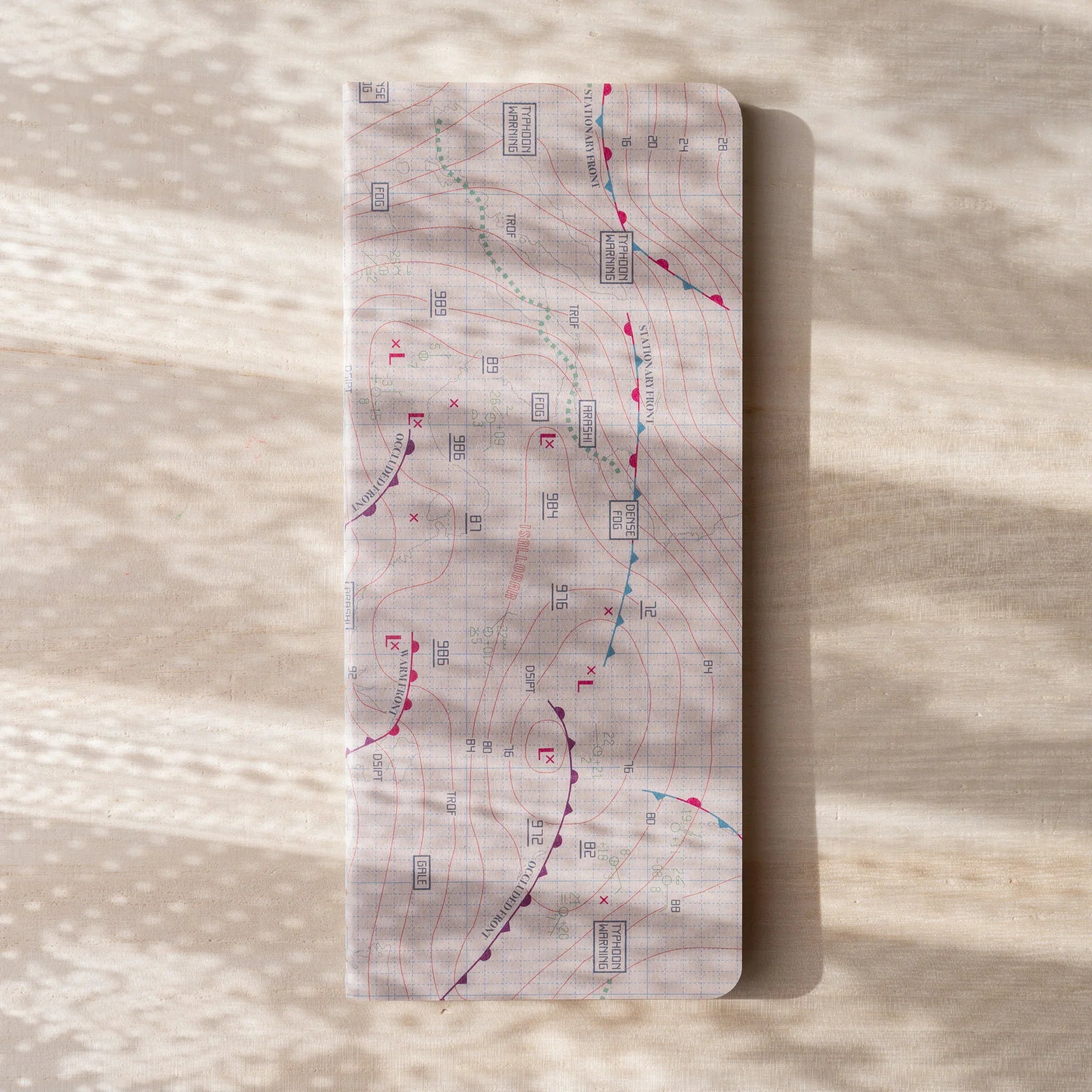 RO-BIKI Weather Map Notebook, lifestyle arrangement showing use providing full visual representation and product details