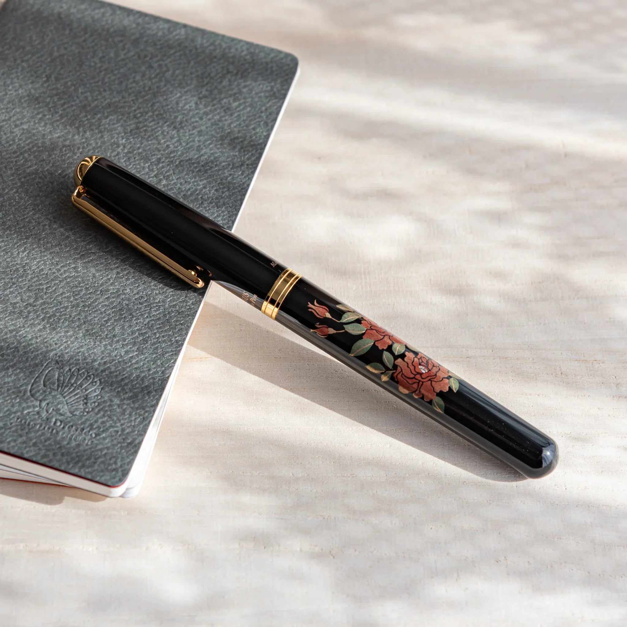 Rose Yamanaka fountain pen with lacquer design shown in composition shown in detail view product composition view