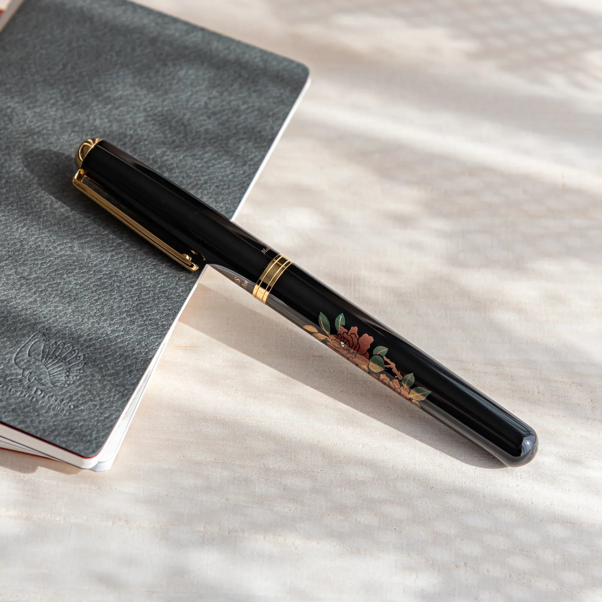 Rose Yamanaka fountain pen with lacquer design shown in composition displayed in composition product composition view