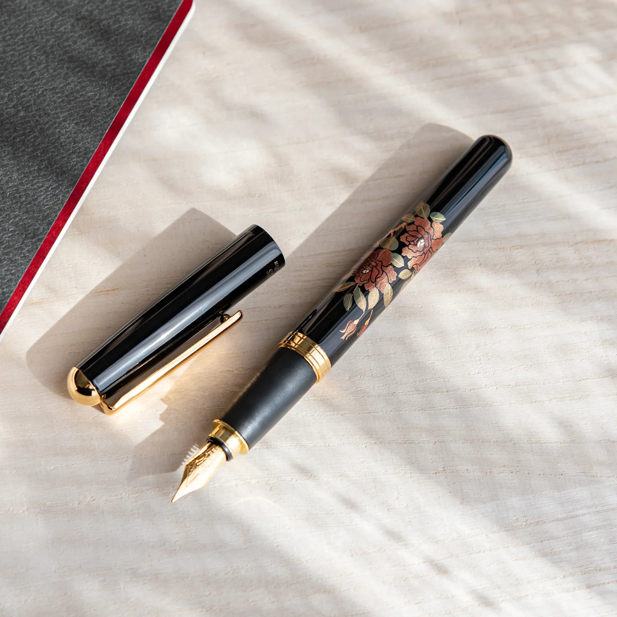 Rose Yamanaka fountain pen with lacquer design shown in composition displayed in detail product composition view