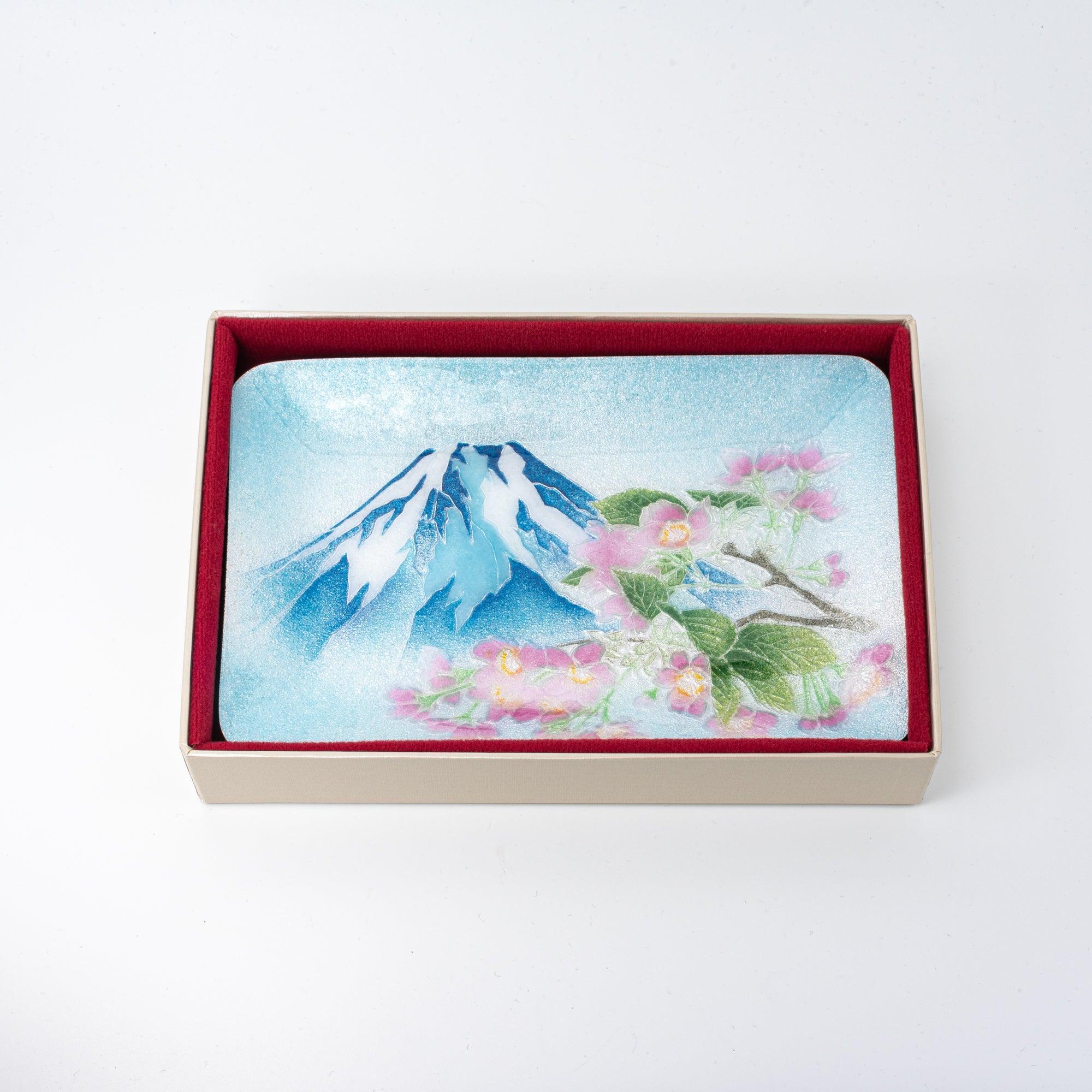 Japanese shippo ware pen tray in cream gift box with red fabric lining, overhead view showing Mt. Fuji and sakura design
