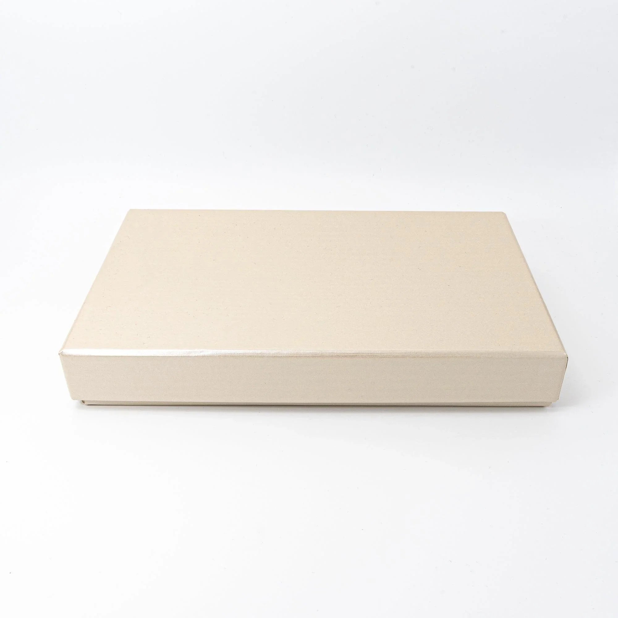 Cream gift box for Japanese shippo ware pen tray, closed view showing plain rectangular lid and box depth on white background