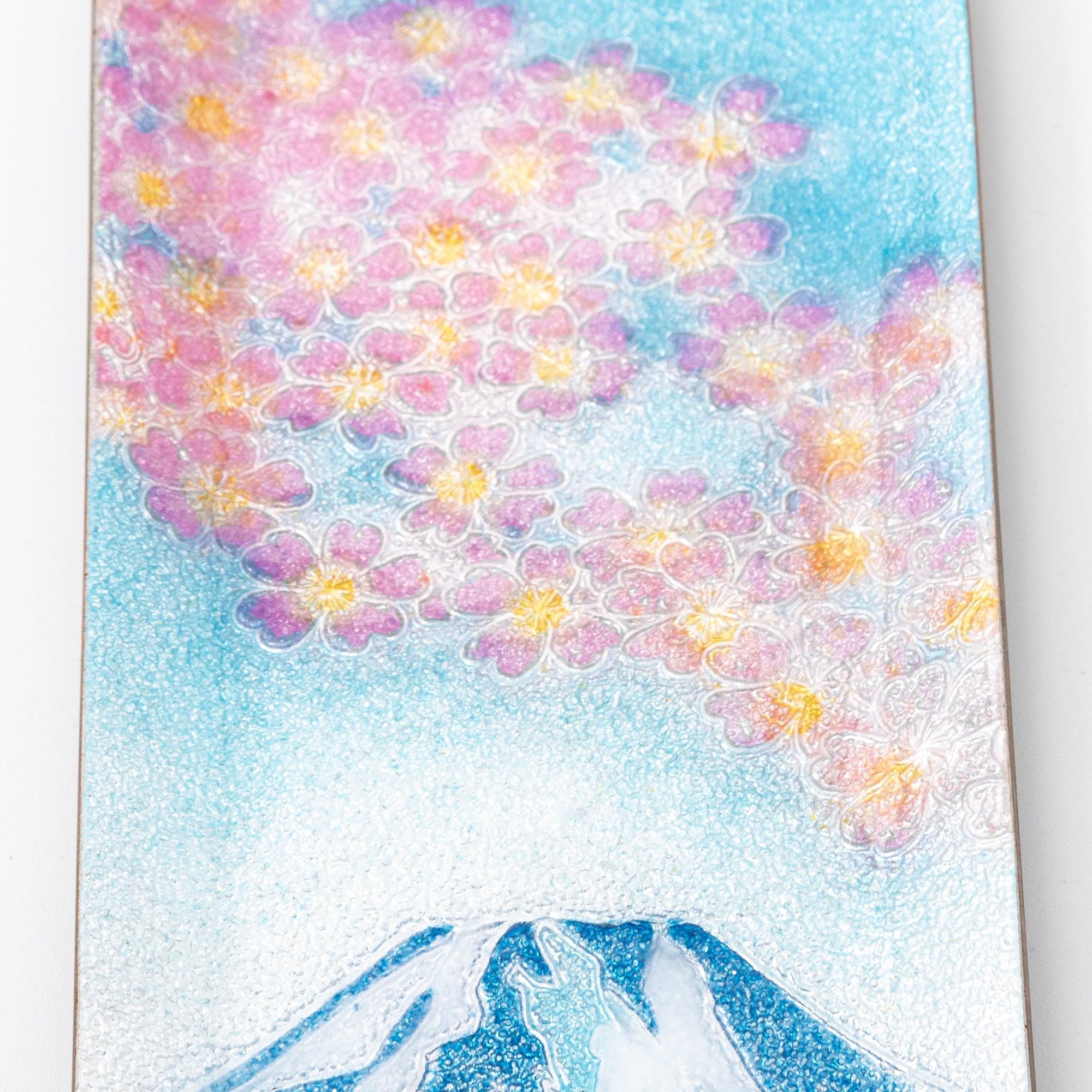 Close-up of sakura and Fuji shippo ware slim pen tray showing dense pink sakura blossoms with gold accents on blue enamel