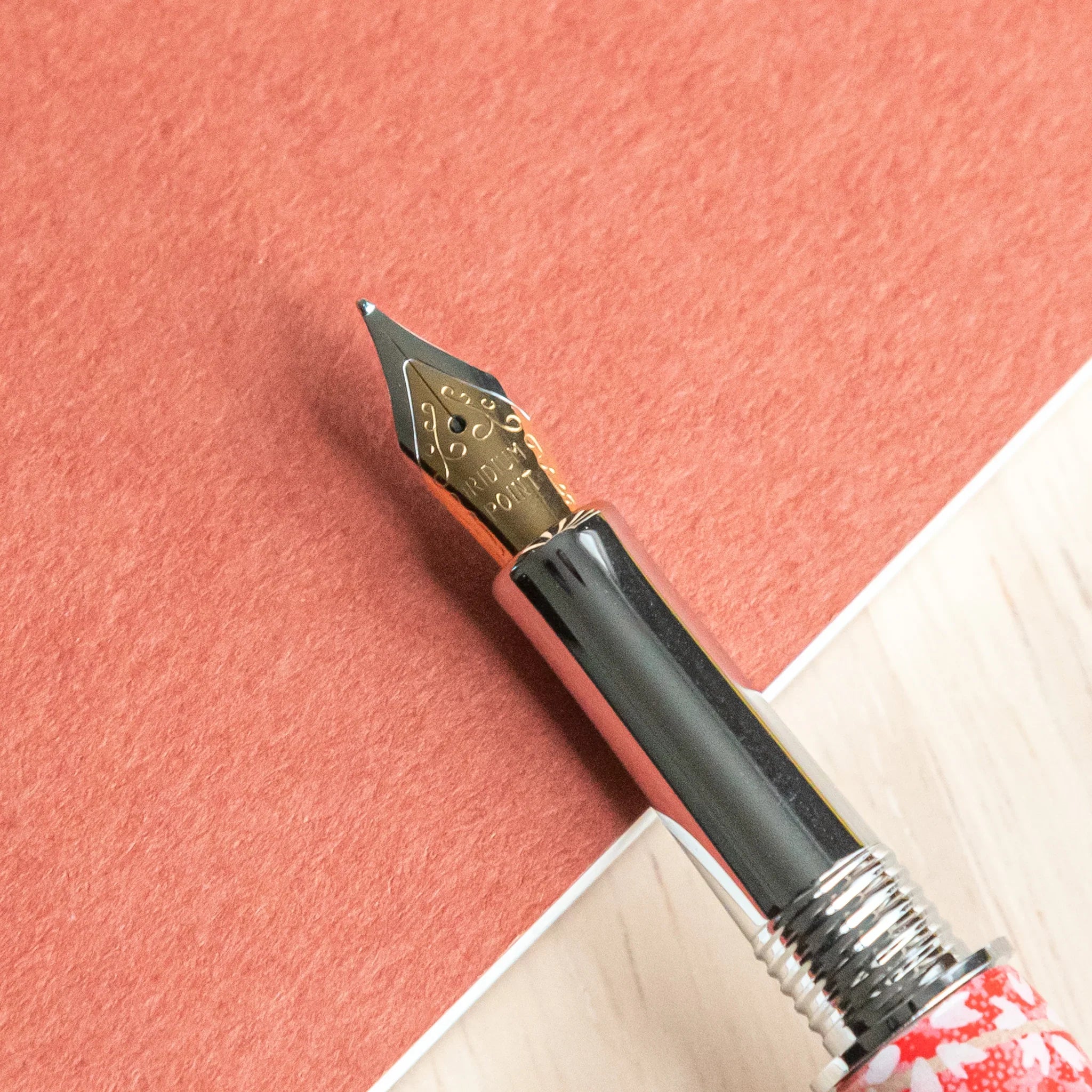 Sakura and Hemp Leaves Mino Washi fountain pen showing sakura and hemp leaf botanical design details angled view