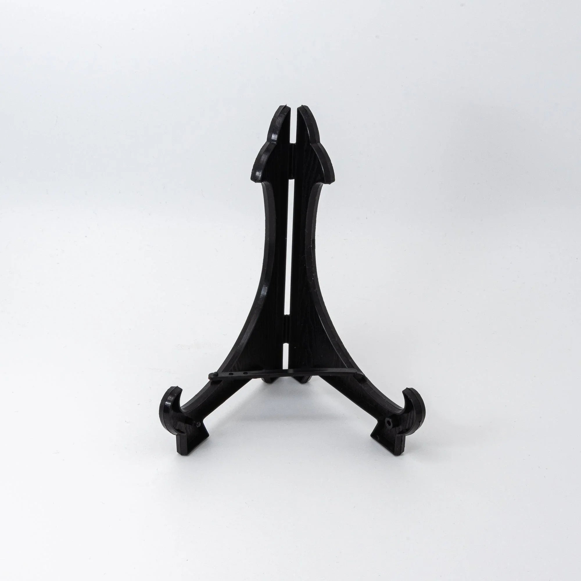 Black plastic display easel stand included with the sakura shippo ware pen tray, shown on white background