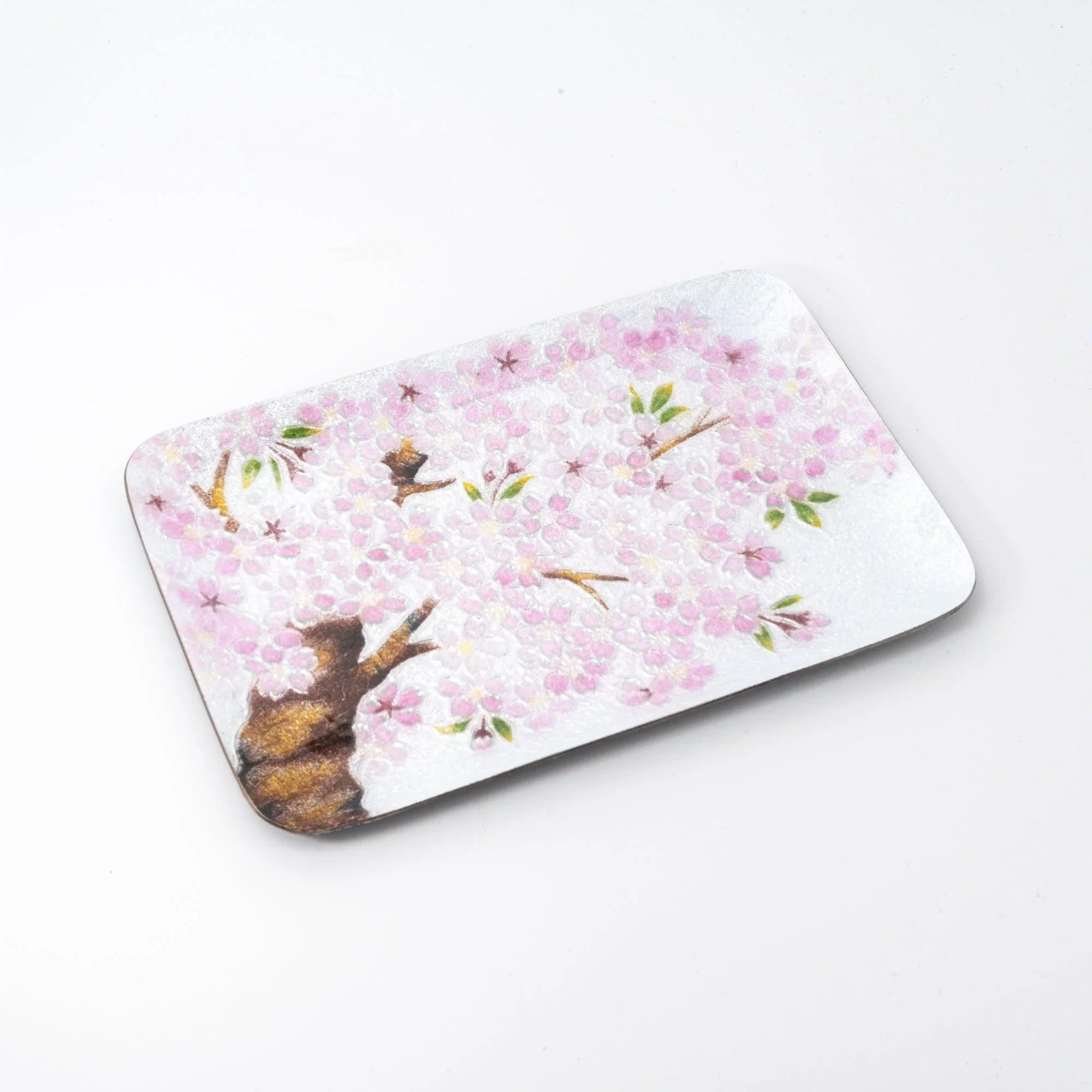 Sakura shippo ware silver pen tray on white background, angled view showing pink sakura blossom and tree design