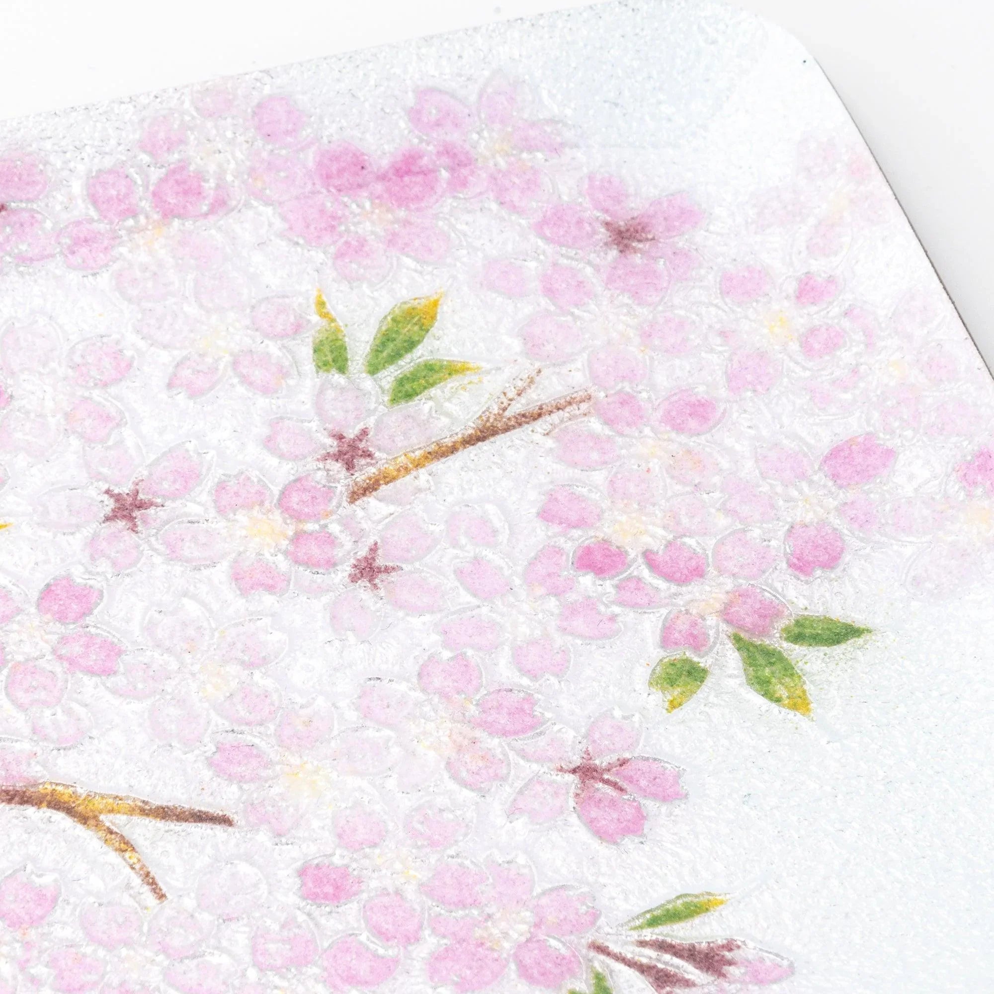 Close-up of sakura shippo ware pen tray showing silver enamel texture with pink sakura blossoms and green leaves