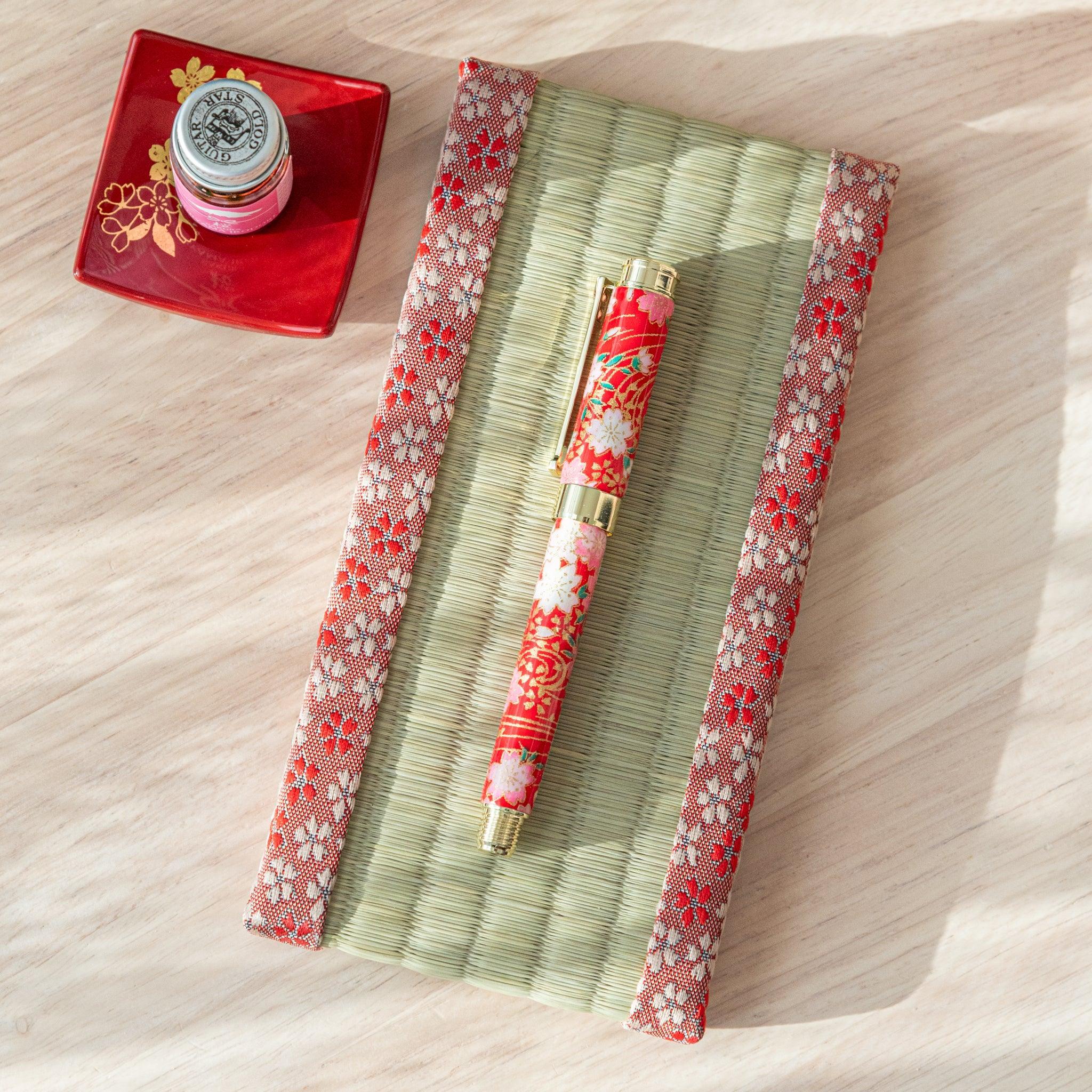 Sakura tatami pen tray top view with cherry blossom pattern woven in straw-colored tatami, traditional Japanese holder