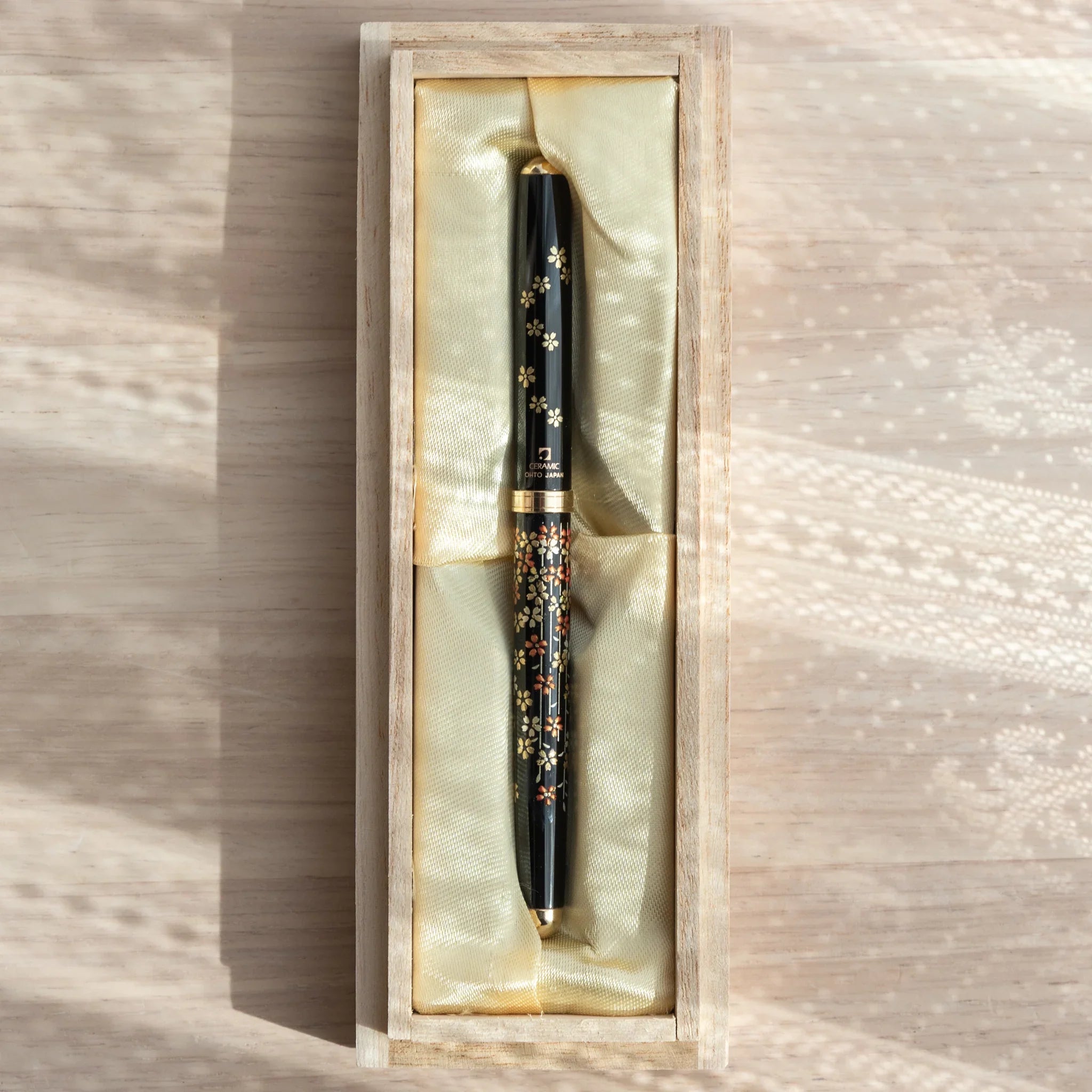 Japanese Ballpoint Pen with traditional lacquer sakura motifs in a gold silk box.