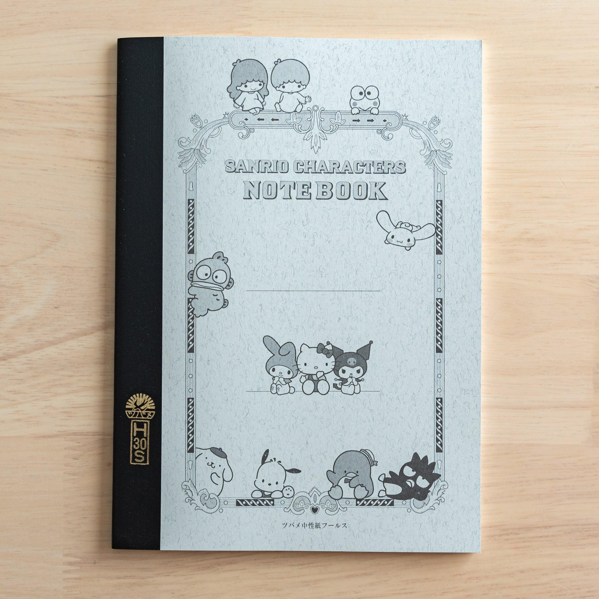 A Japanese notebook with a black spine and a gray cover featuring Sanrio characters in a vintage-style frame. "SANRIO CHARACTERS NOTEBOOK" is printed in the center.