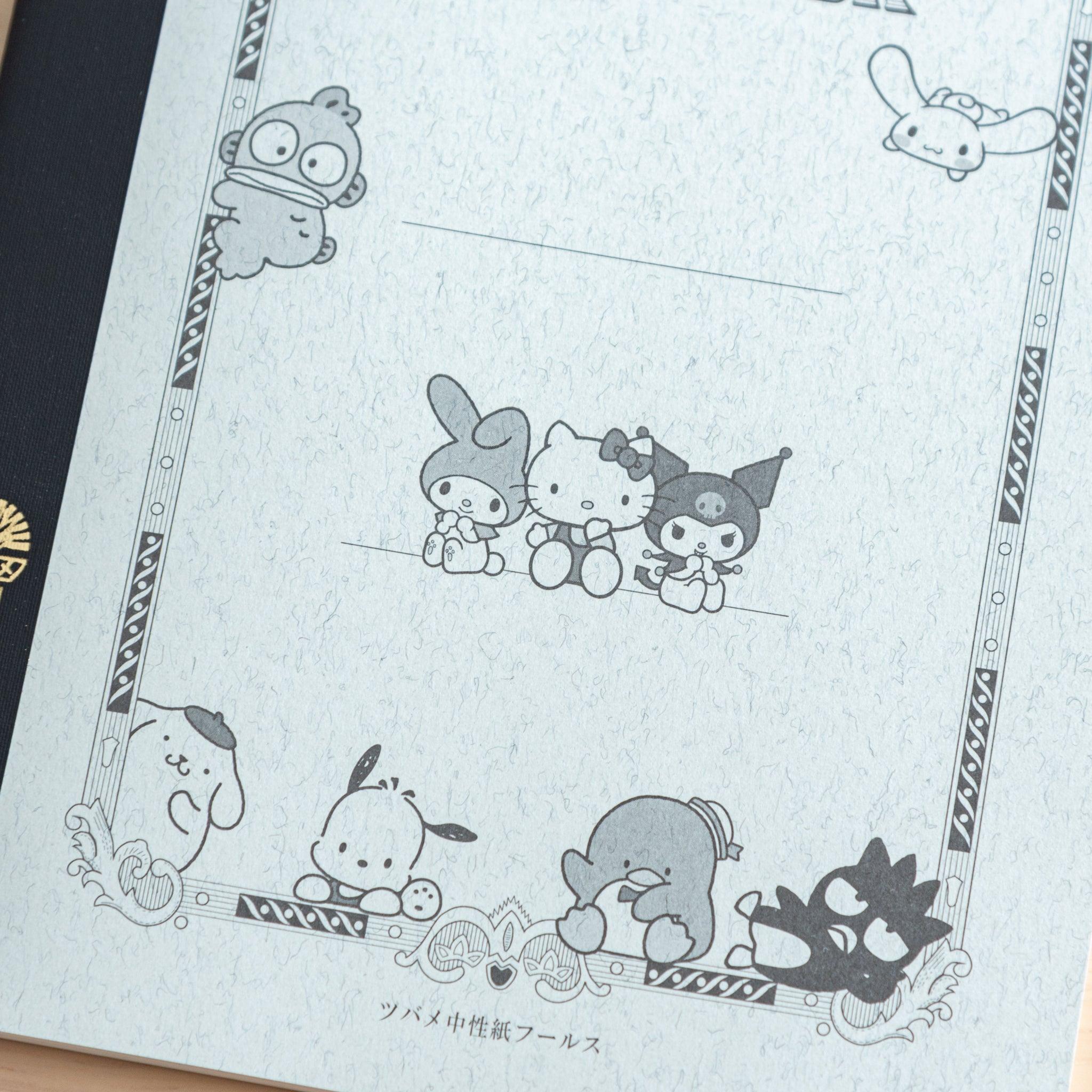 A detailed view of a Japanese notebook cover showcasing Sanrio characters like Pompompurin and Badtz-Maru in a classic design with ornate borders.