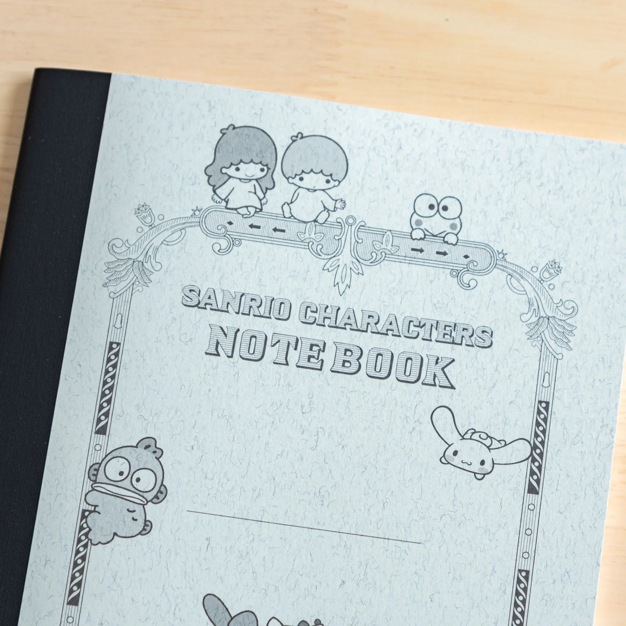 Sanrio Characters Tsubame Fools A5 notebook displaying interior grid pages and binding structure on plain white surface