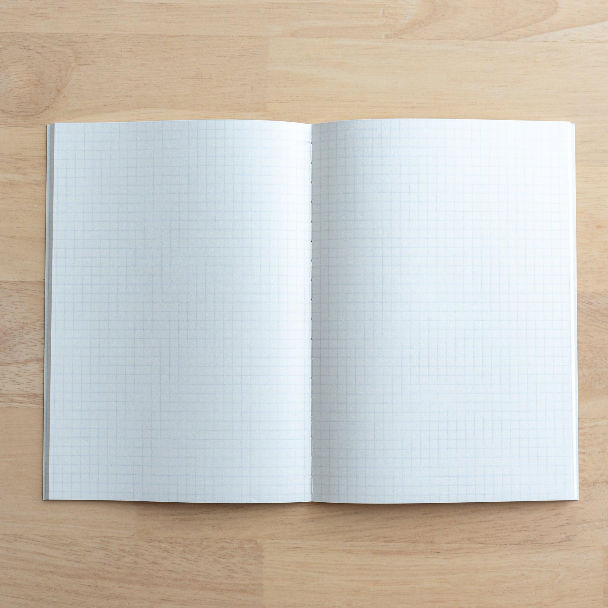 A fully opened Tsubame Japanese notebook featuring two pages of smooth grid paper, designed for writing and sketching, representing high-quality Japanese stationery.