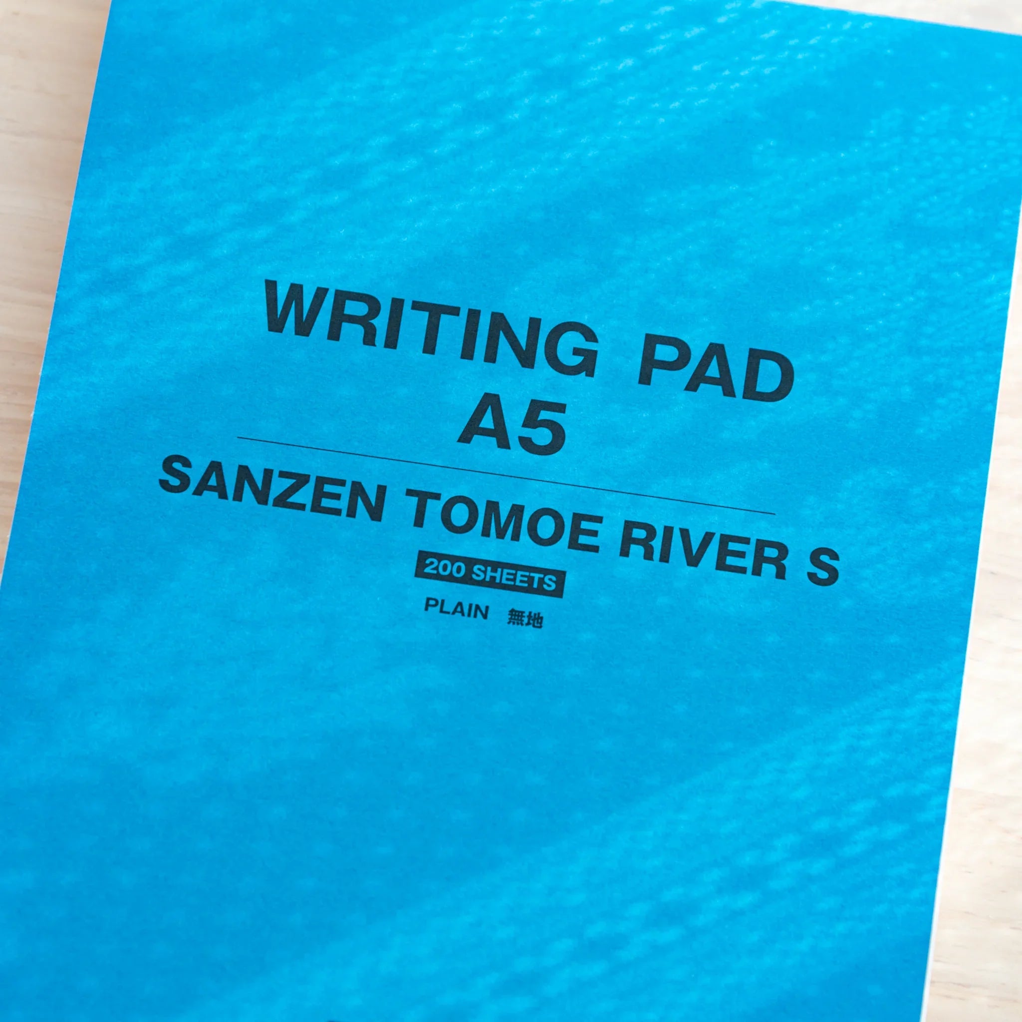 Close-up of blue cover on Sanzen Tomoe River Writing Pad A5, premium Japanese Writing Pad with 200 sheets.