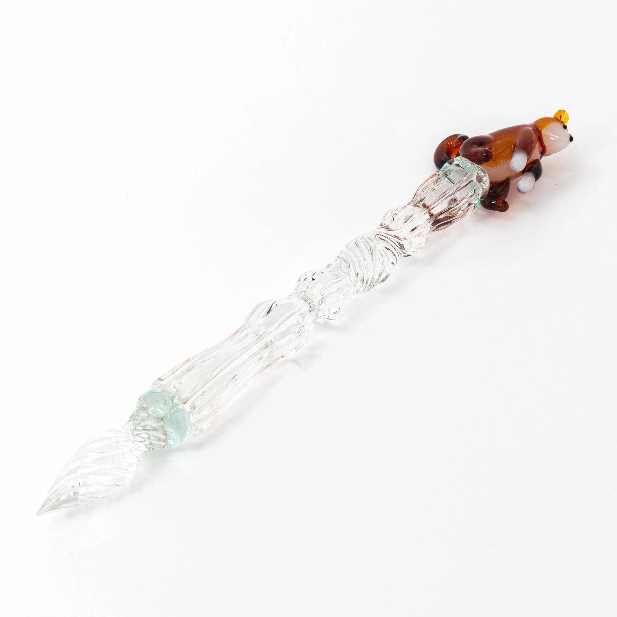 Japanese glass dip pen with decorative ceramic Shiba Inu dog topper and textured ribbed glass barrel composition