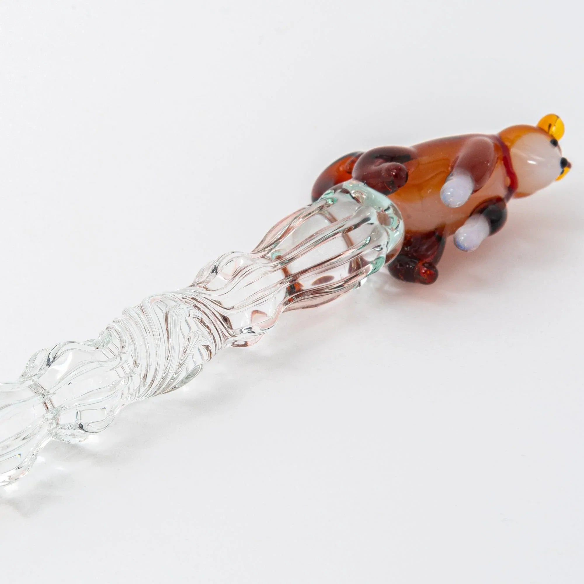 Japanese glass dip pen featuring detailed reddish-brown ceramic Shiba Inu dog sculpture topper, fine detail view
