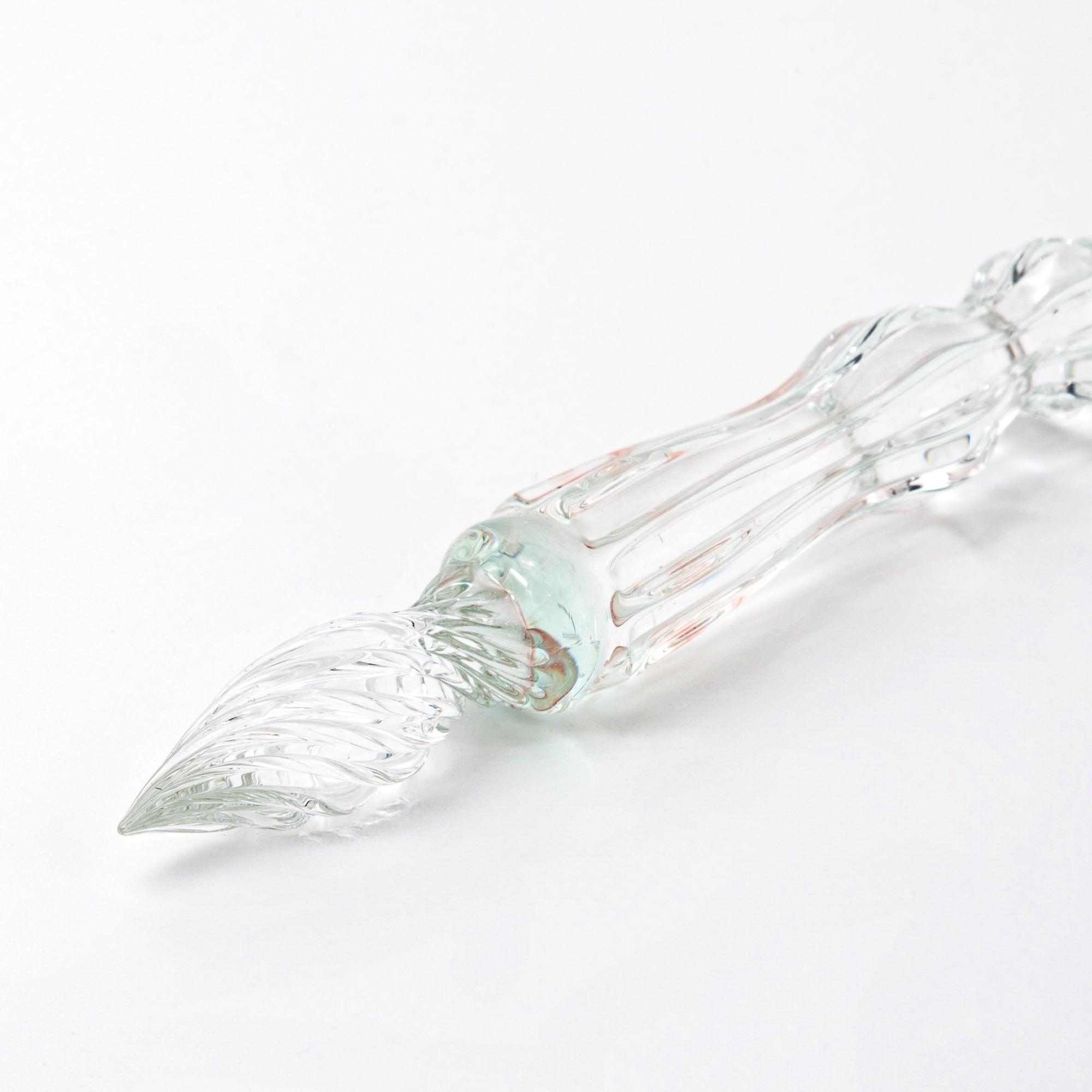 Detailed glass pen with Shiba Inu topper and clear light green shaft, close-up of the nib. A must-have for collectors.