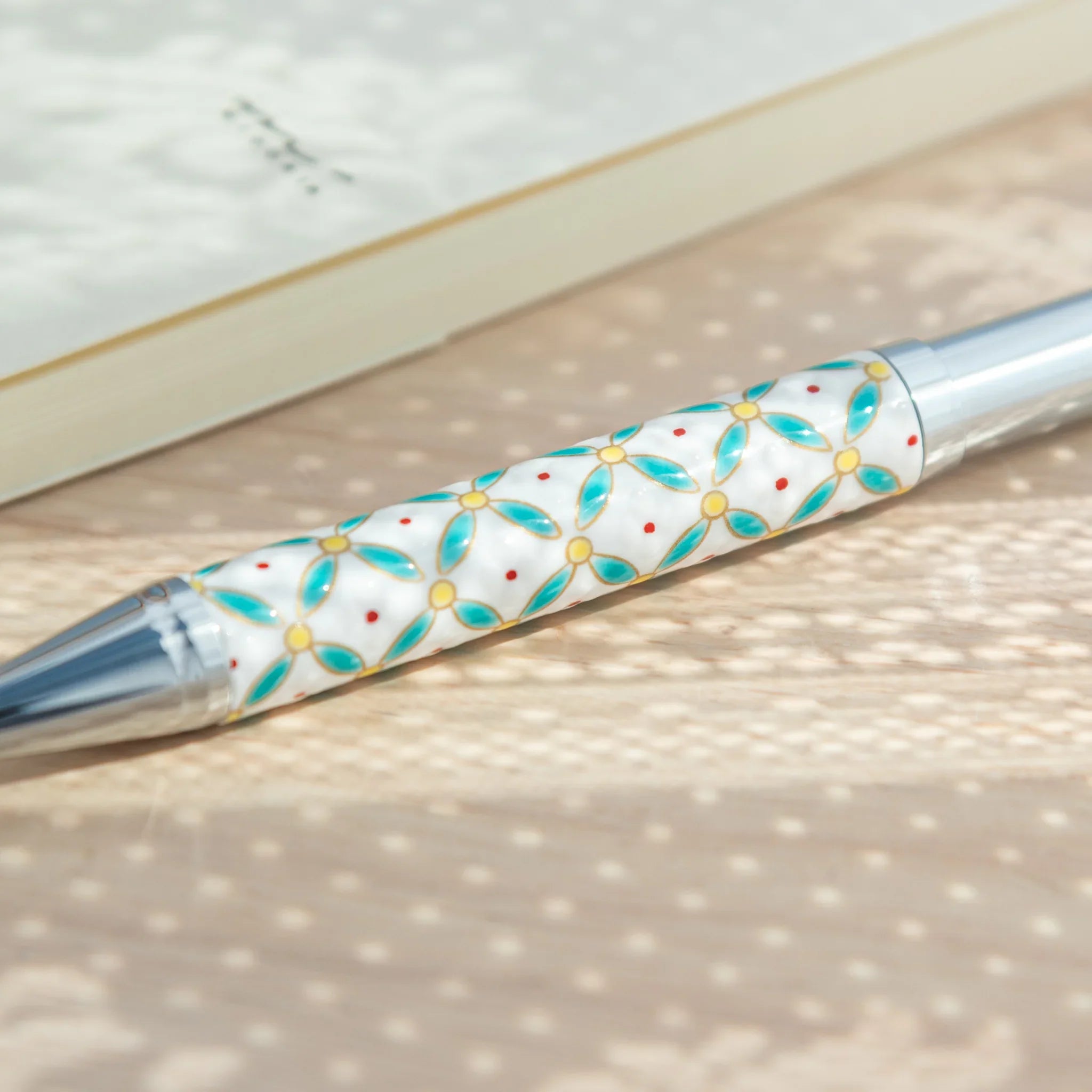 Decorative Kutani ceramic ballpoint pen with shippo diamond and floral pattern for writing featuring traditional
