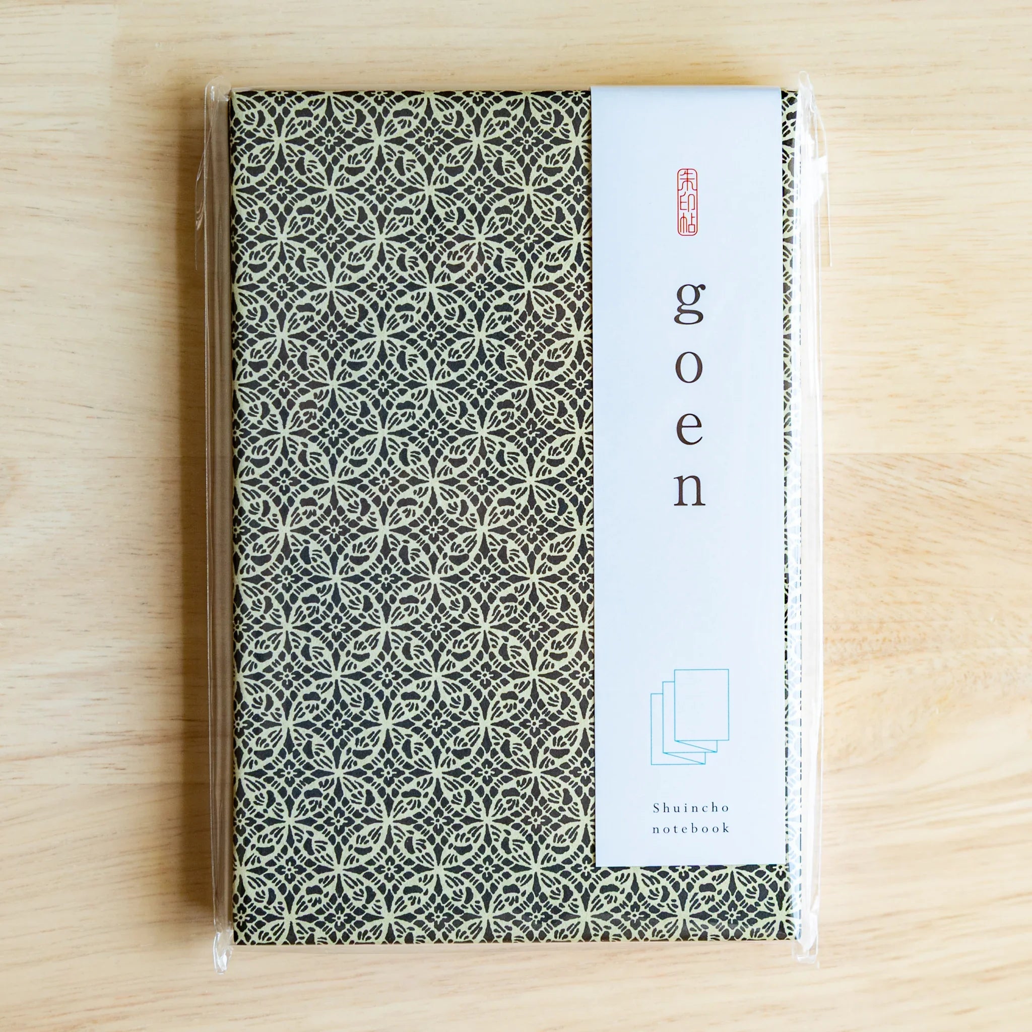 Shippo Pattern washi goshuincho in original packaging with white goen belly band and Shuincho notebook label on light wood