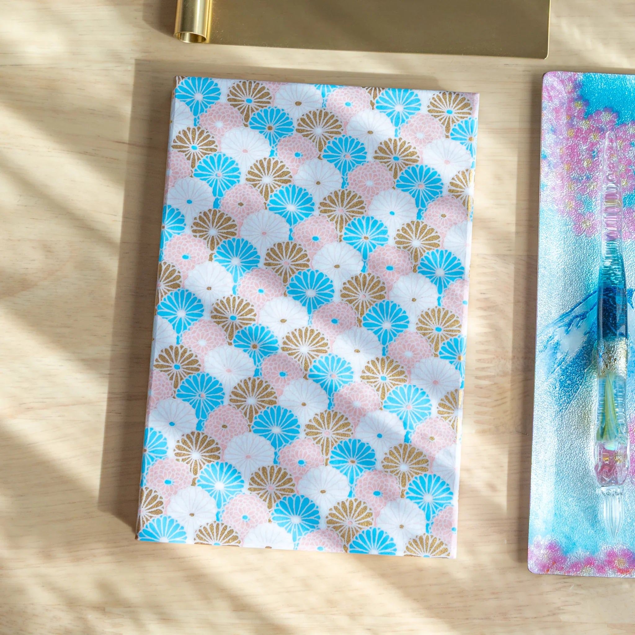 Sky Blossom Pastel Chrysanthemum Washi Goshuincho closed cover showing soft blue washi with pale chrysanthemum design
