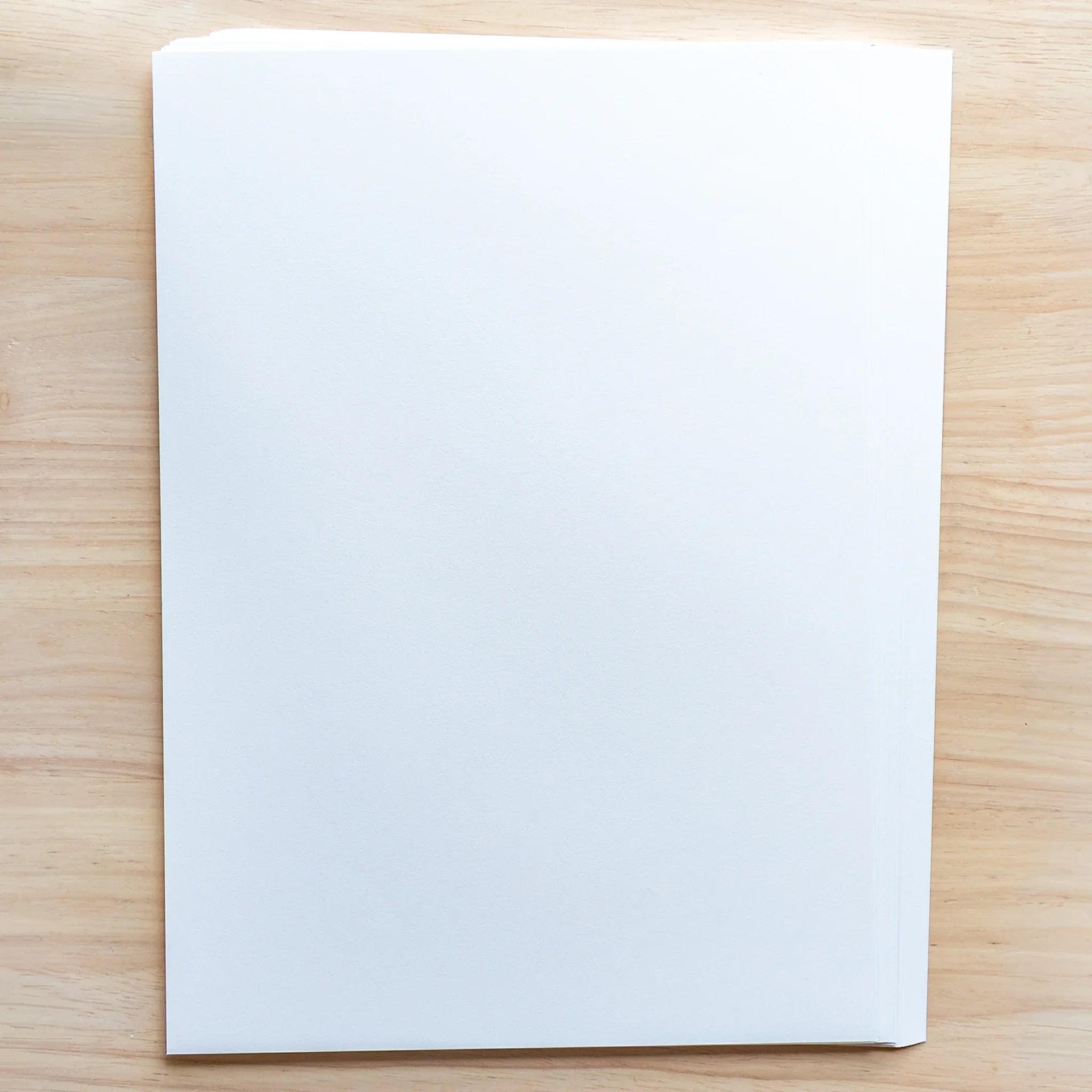 Stack of Solist A4 Japanese Loose Leaf Paper, white sheets with refined surface for long-lasting premium writing.