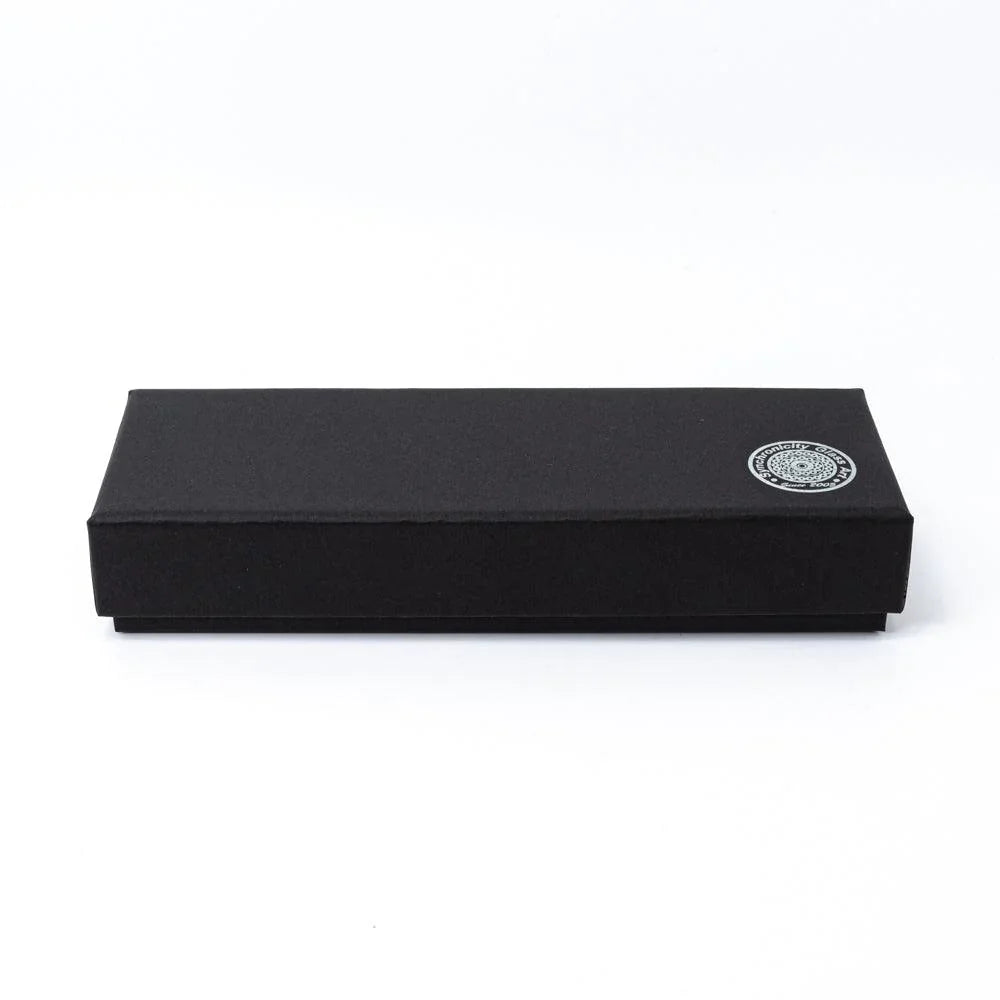 Black gift box for Smoke in Azure blue glass dip pen angled on white background showing product packaging