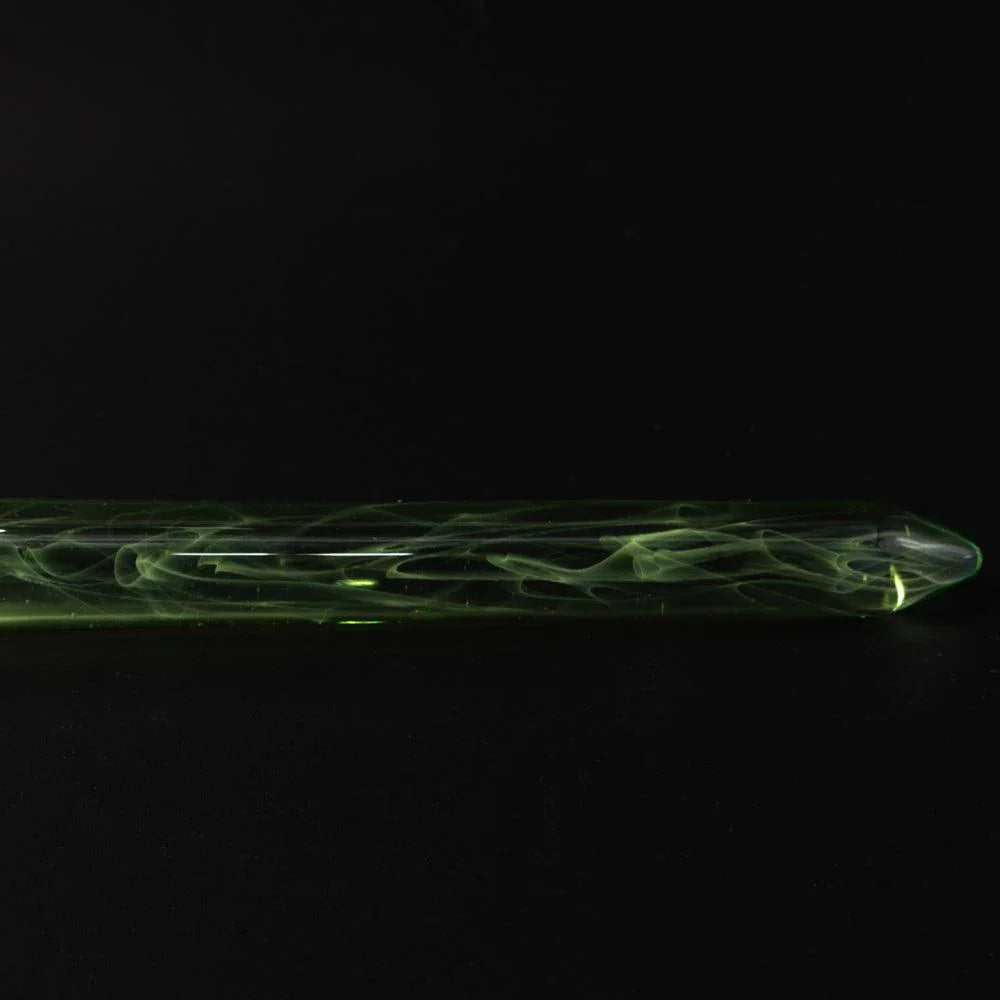 Extreme closeup green glass barrel showing yellow-green swirling smoke patterns in Japanese glass dip pen