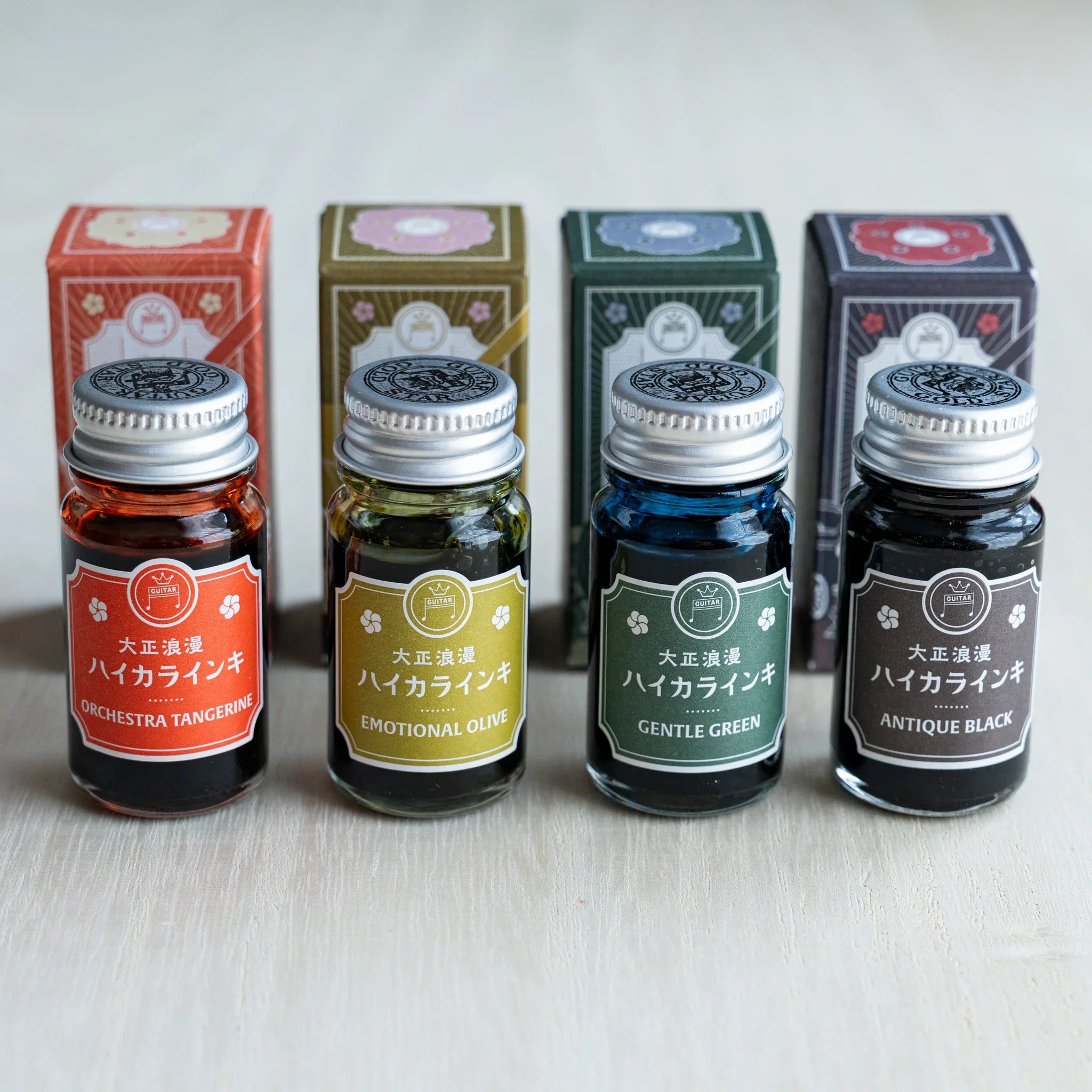 Taisho Romance HAIKARA Esprit ink set, four 12 ml bottles standing in front of their illustrated boxes